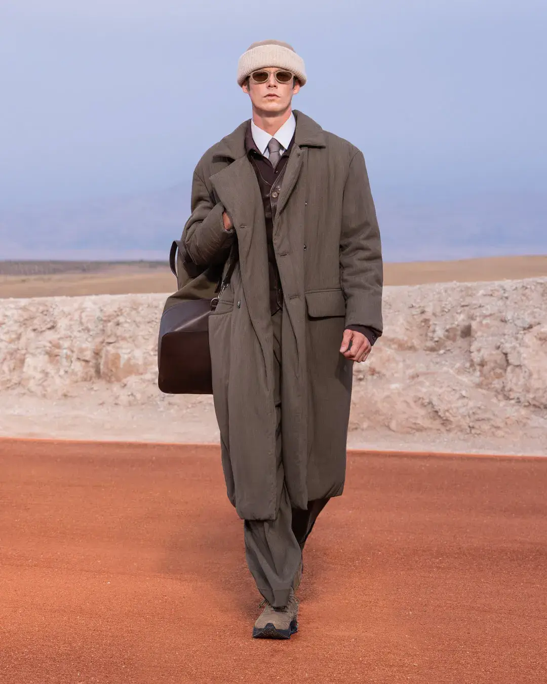 GIORGIO ARMANI AND KITH PRESENT DREAMS OF THE DUNE IN MARRAKECH image about the Giorgio Armani and Kith menswear collection Dreams of the Dune, shown in the Agafay Desert near Marrakech, with details on the clothing, the ASICS, Diemme and ‘47 collaborations, and the 16 October launch. (image 8 of 18)