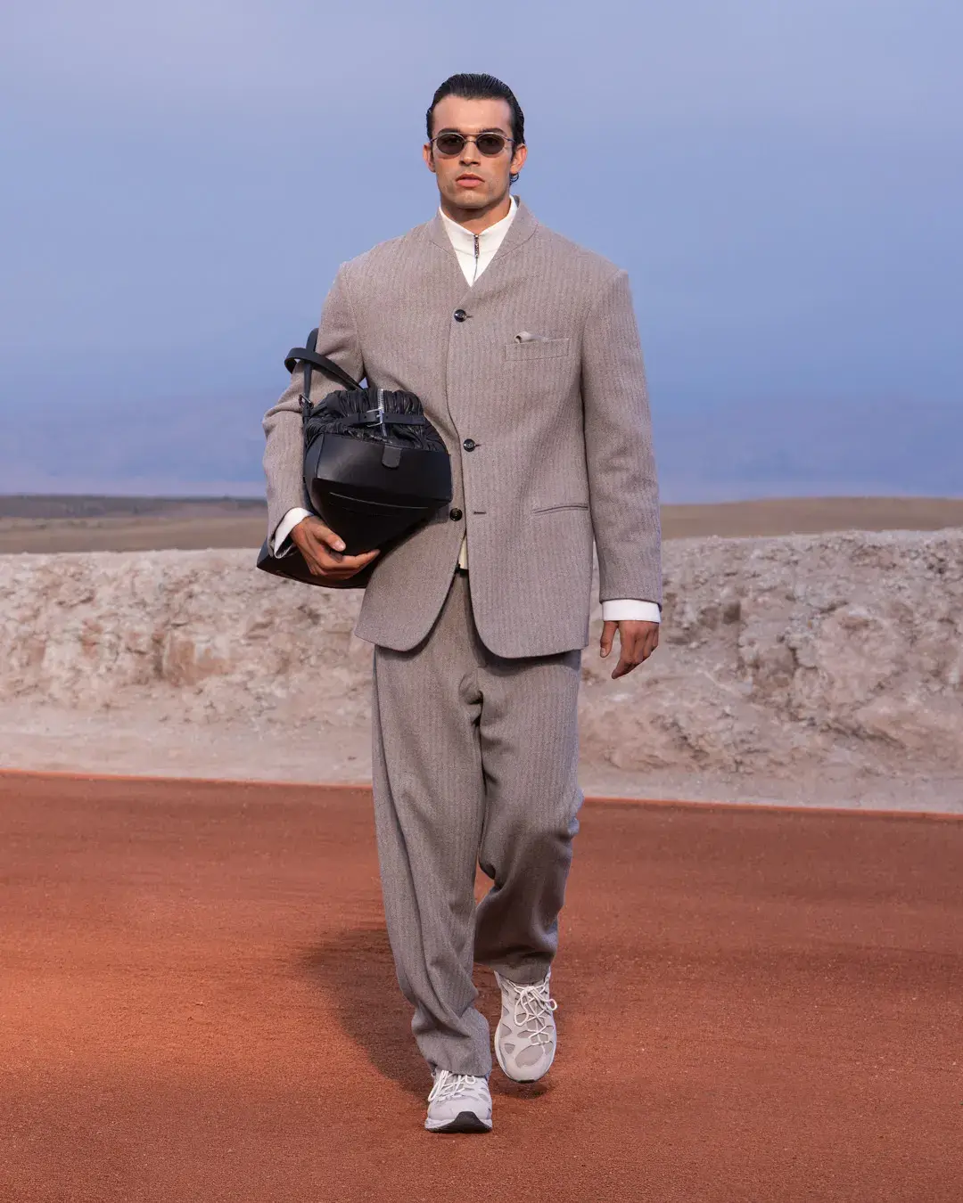 GIORGIO ARMANI AND KITH PRESENT DREAMS OF THE DUNE IN MARRAKECH image about the Giorgio Armani and Kith menswear collection Dreams of the Dune, shown in the Agafay Desert near Marrakech, with details on the clothing, the ASICS, Diemme and ‘47 collaborations, and the 16 October launch. (image 12 of 18)