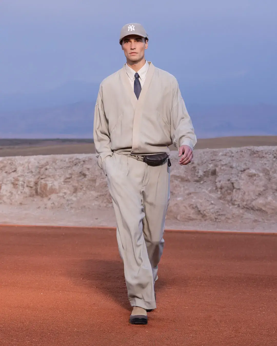 GIORGIO ARMANI AND KITH PRESENT DREAMS OF THE DUNE IN MARRAKECH image about the Giorgio Armani and Kith menswear collection Dreams of the Dune, shown in the Agafay Desert near Marrakech, with details on the clothing, the ASICS, Diemme and ‘47 collaborations, and the 16 October launch. (image 13 of 18)