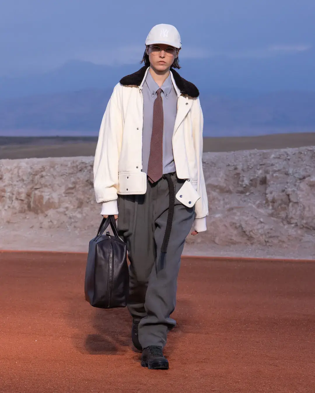 GIORGIO ARMANI AND KITH PRESENT DREAMS OF THE DUNE IN MARRAKECH image about the Giorgio Armani and Kith menswear collection Dreams of the Dune, shown in the Agafay Desert near Marrakech, with details on the clothing, the ASICS, Diemme and ‘47 collaborations, and the 16 October launch. (image 17 of 18)