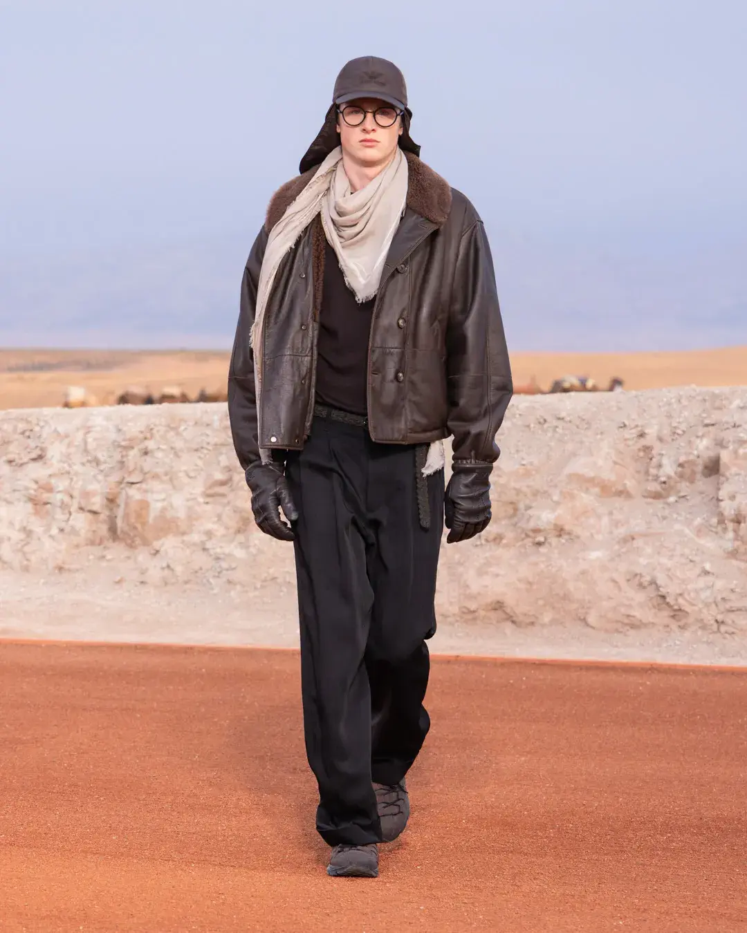 GIORGIO ARMANI AND KITH PRESENT DREAMS OF THE DUNE IN MARRAKECH image about the Giorgio Armani and Kith menswear collection Dreams of the Dune, shown in the Agafay Desert near Marrakech, with details on the clothing, the ASICS, Diemme and ‘47 collaborations, and the 16 October launch. (image 5 of 18)