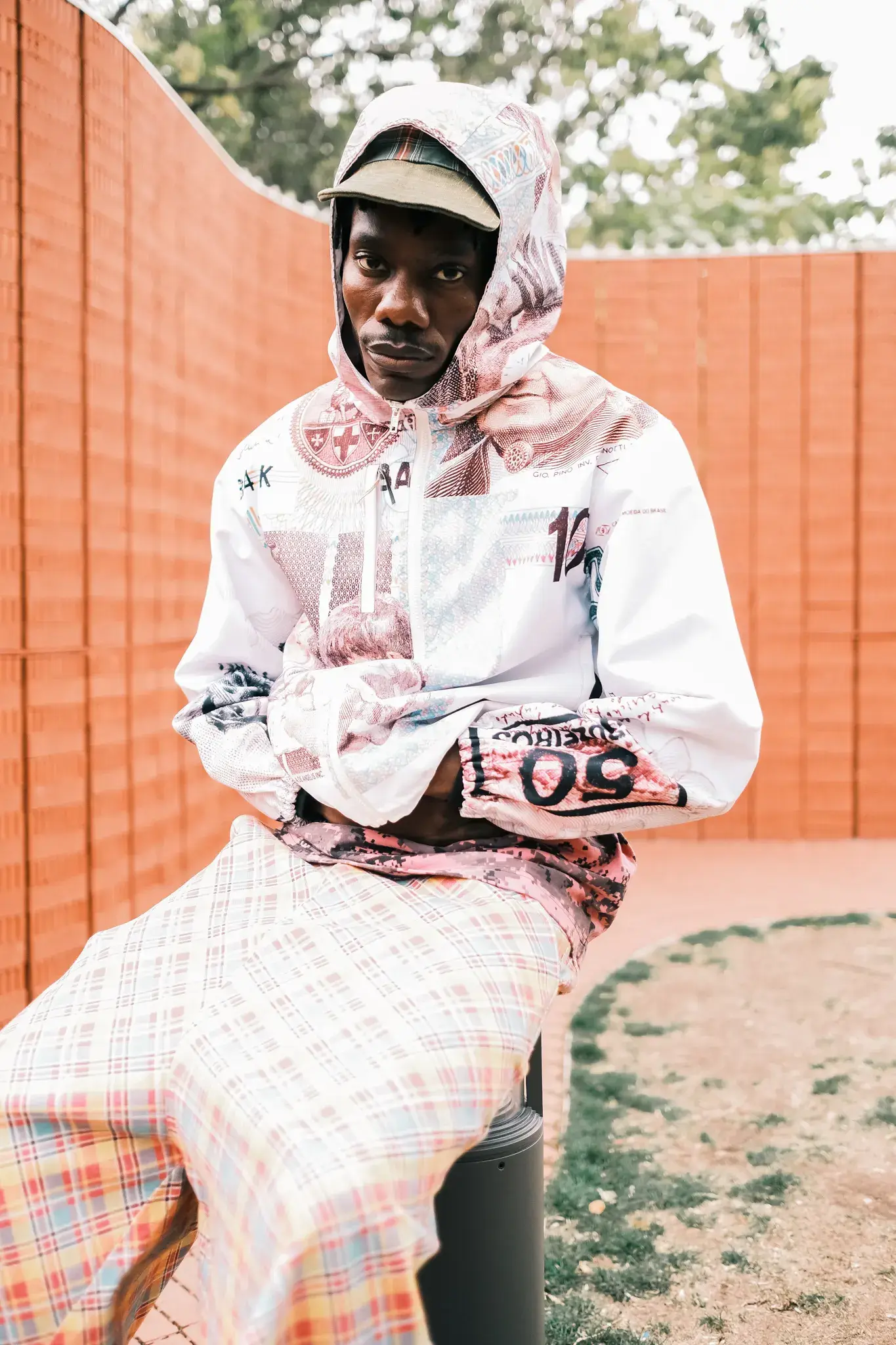 GOGO LUPIN: PINK, IDENTITY & CREATIVE FREEDOM image of multidisciplinary artist Gogo Lupin posing in a pink-accented outfit during a portrait session for his Casawi interview. (image 5 of 6)