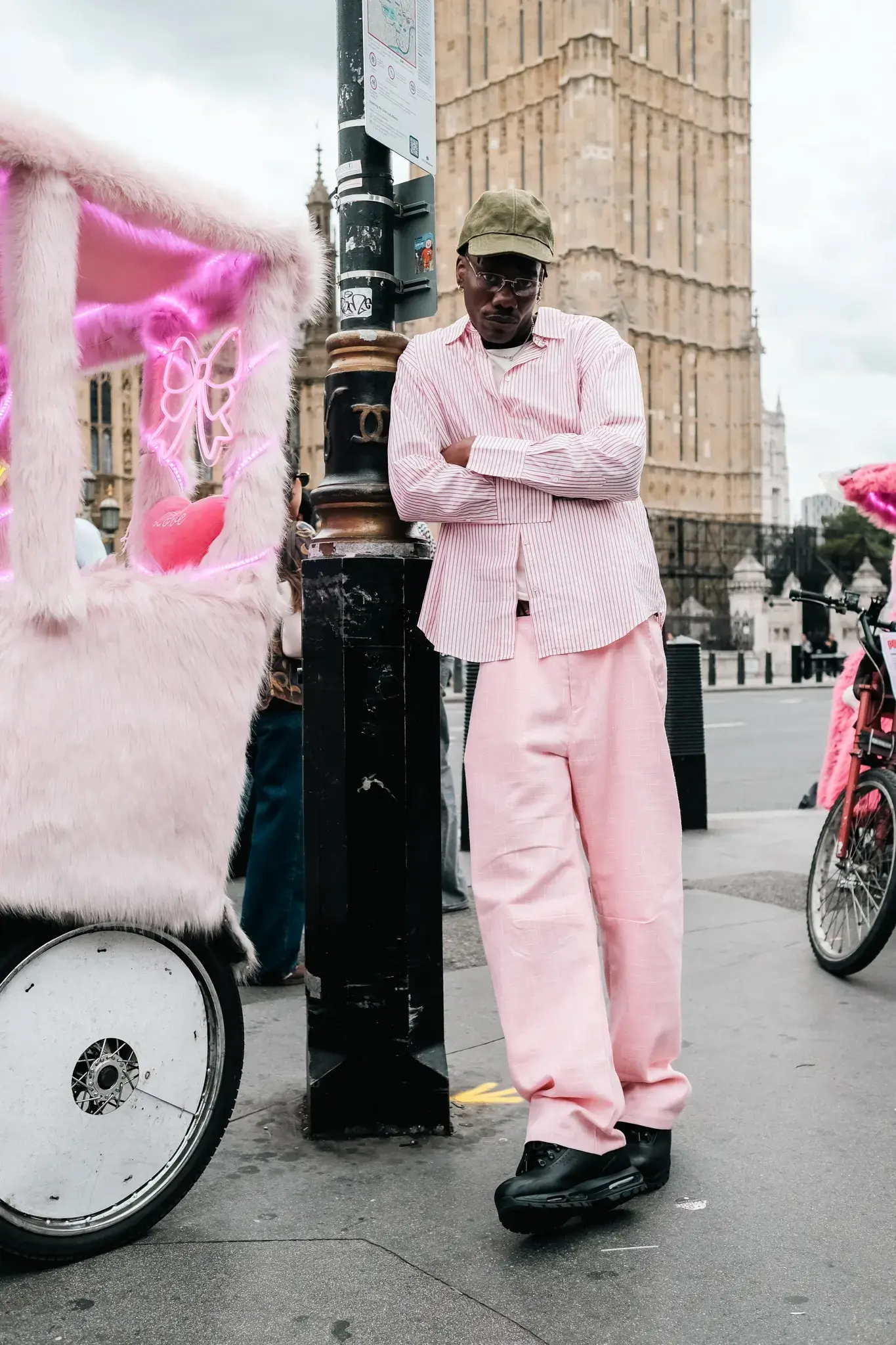 GOGO LUPIN: PINK, IDENTITY & CREATIVE FREEDOM image of multidisciplinary artist Gogo Lupin posing in a pink-accented outfit during a portrait session for his Casawi interview. (image 1 of 6)