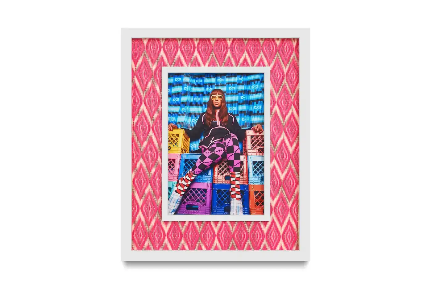 Courtesy Of The Artist And Hannah Traore Gallery Portrait gallery wall showing Hassan Hajjaj's photographs in colorful recycled Moroccan floor mat frames. Models wear mixed pattern clothing against vibrant backgrounds. (image 5 of 7)