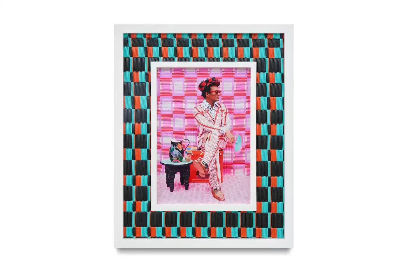Courtesy Of The Artist And Hannah Traore Gallery Portrait gallery wall showing Hassan Hajjaj's photographs in colorful recycled Moroccan floor mat frames. Models wear mixed pattern clothing against vibrant backgrounds. (image 7 of 7)