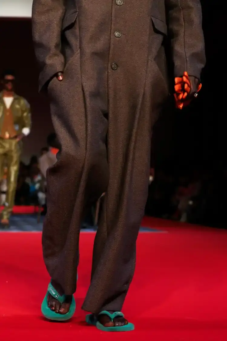 HAVAIANAS X KIDSUPER DEBUT PARIS FASHION WEEK Havaianas collaborates with New York streetwear brand KidSuper to create green velvet flip-flops resembling soccer field grass, shown at Paris Men's Fashion Week Fall/Winter 2026. (image 3 of 7)