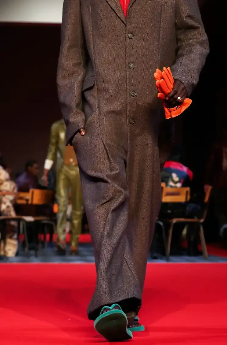 HAVAIANAS X KIDSUPER DEBUT PARIS FASHION WEEK Havaianas collaborates with New York streetwear brand KidSuper to create green velvet flip-flops resembling soccer field grass, shown at Paris Men's Fashion Week Fall/Winter 2026. (image 4 of 7)
