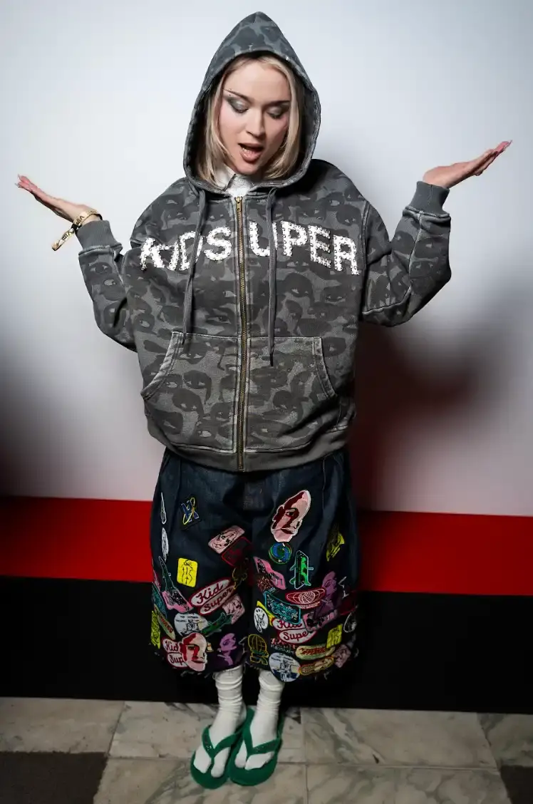 HAVAIANAS X KIDSUPER DEBUT PARIS FASHION WEEK Havaianas collaborates with New York streetwear brand KidSuper to create green velvet flip-flops resembling soccer field grass, shown at Paris Men's Fashion Week Fall/Winter 2026. (image 6 of 7)