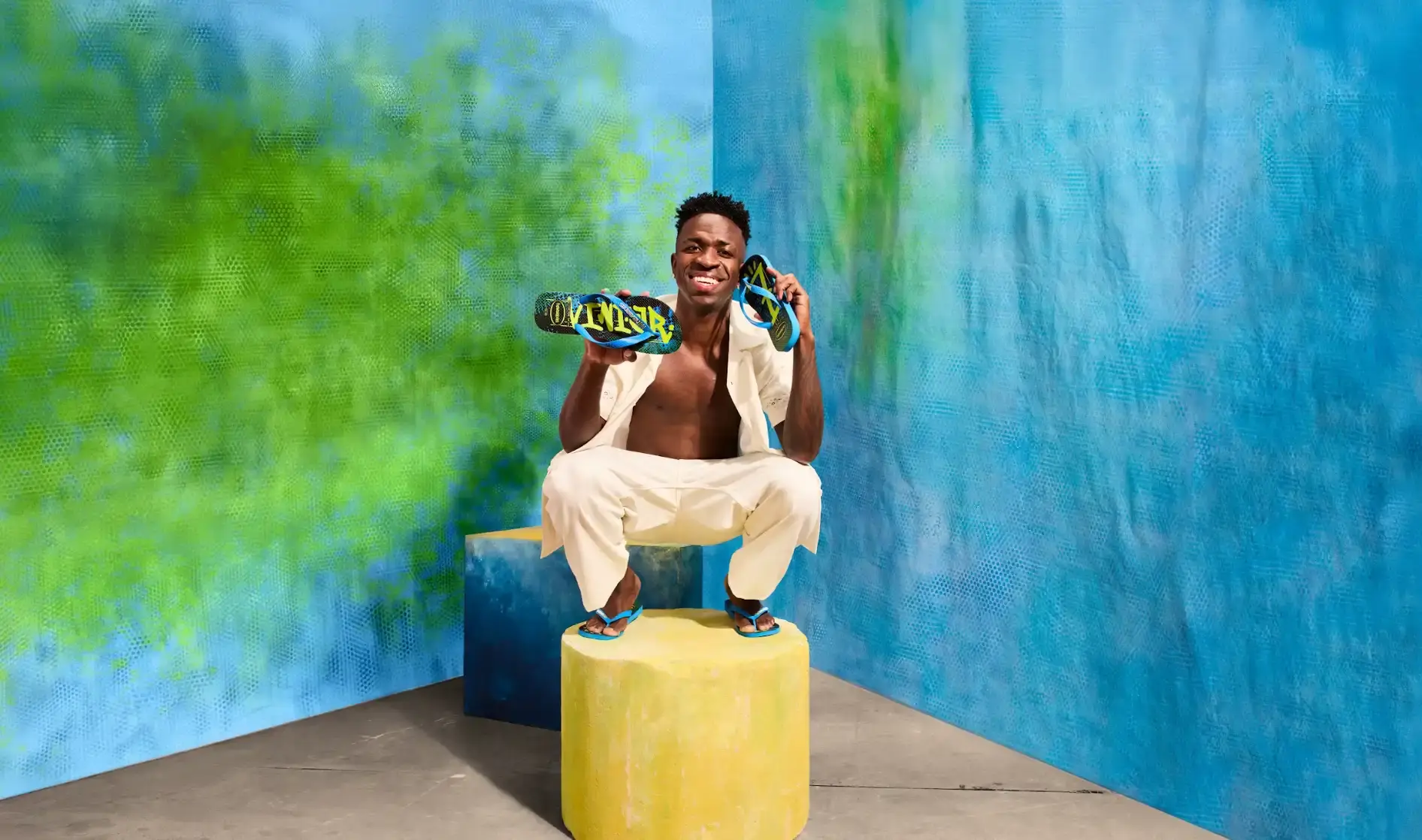 HAVAIANAS AND VINI JR RELEASE NEW COLLECTION An image detailing the new Havaianas shoe collection created with Brazilian football player Vini Jr, including release dates, prices, and design themes.