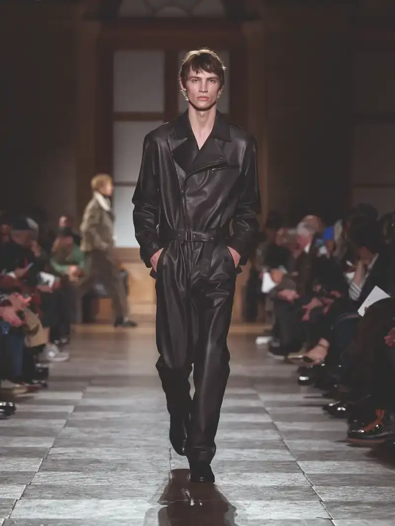 HERMÈS MENSWEAR FW26 COLLECTION Article about Hermès Fall Winter 2026 menswear collection designed by Véronique Nichanian. The collection emphasizes clean construction, quality fabrics, and interior garment finishing. Color palette ranges from hemp and lichen to saffron and midnight blue. The design philosophy focuses on timeless pieces and precise craftsmanship. (image 6 of 58)