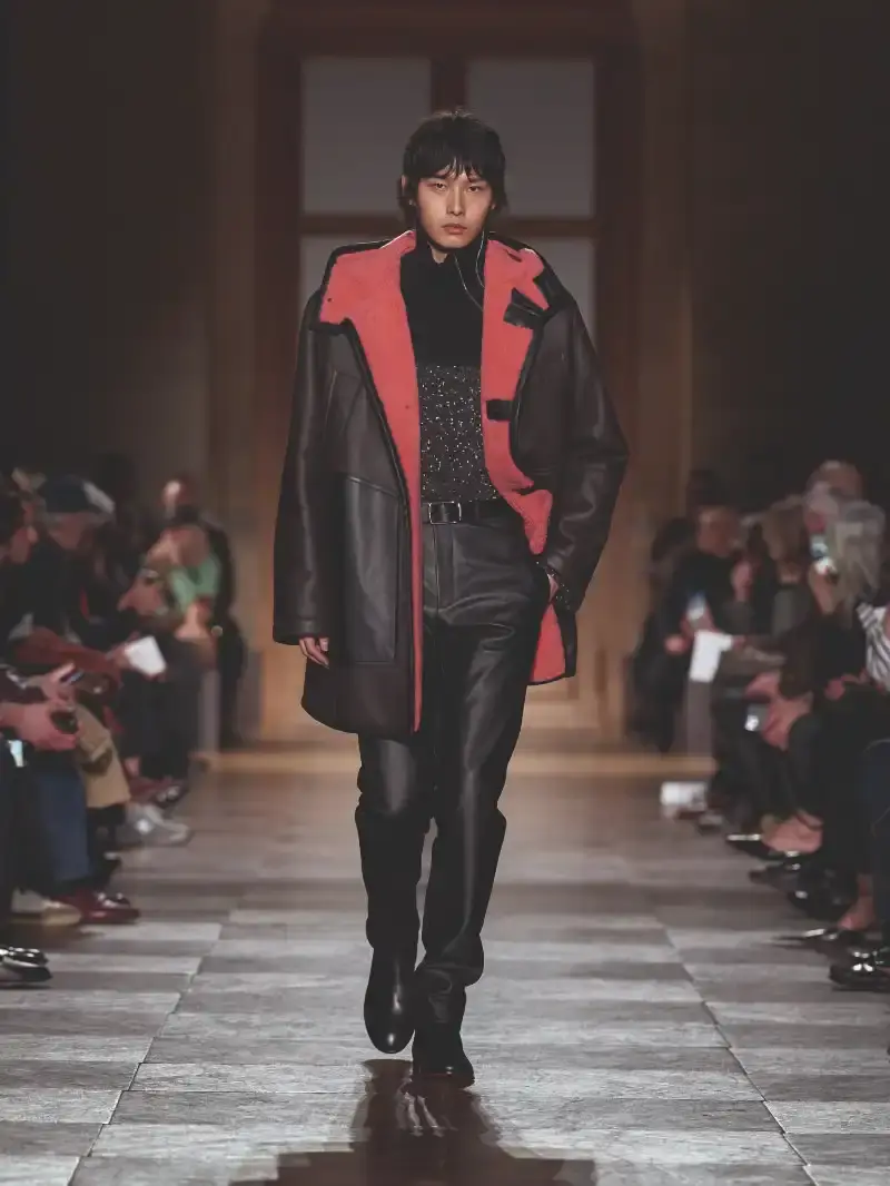 HERMÈS MENSWEAR FW26 COLLECTION Article about Hermès Fall Winter 2026 menswear collection designed by Véronique Nichanian. The collection emphasizes clean construction, quality fabrics, and interior garment finishing. Color palette ranges from hemp and lichen to saffron and midnight blue. The design philosophy focuses on timeless pieces and precise craftsmanship. (image 37 of 58)