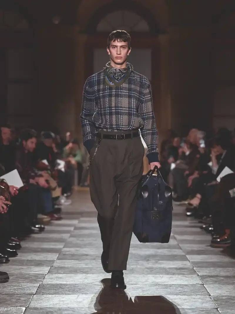 HERMÈS MENSWEAR FW26 COLLECTION Article about Hermès Fall Winter 2026 menswear collection designed by Véronique Nichanian. The collection emphasizes clean construction, quality fabrics, and interior garment finishing. Color palette ranges from hemp and lichen to saffron and midnight blue. The design philosophy focuses on timeless pieces and precise craftsmanship. (image 10 of 58)