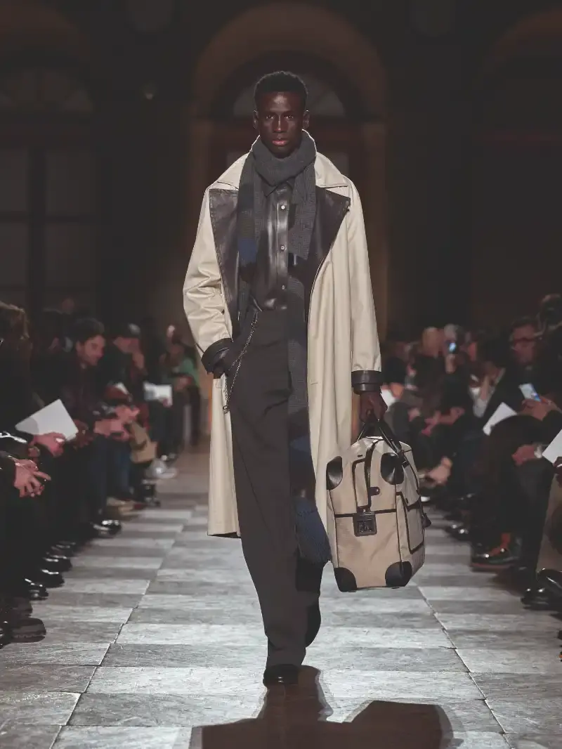 HERMÈS MENSWEAR FW26 COLLECTION Article about Hermès Fall Winter 2026 menswear collection designed by Véronique Nichanian. The collection emphasizes clean construction, quality fabrics, and interior garment finishing. Color palette ranges from hemp and lichen to saffron and midnight blue. The design philosophy focuses on timeless pieces and precise craftsmanship. (image 4 of 58)