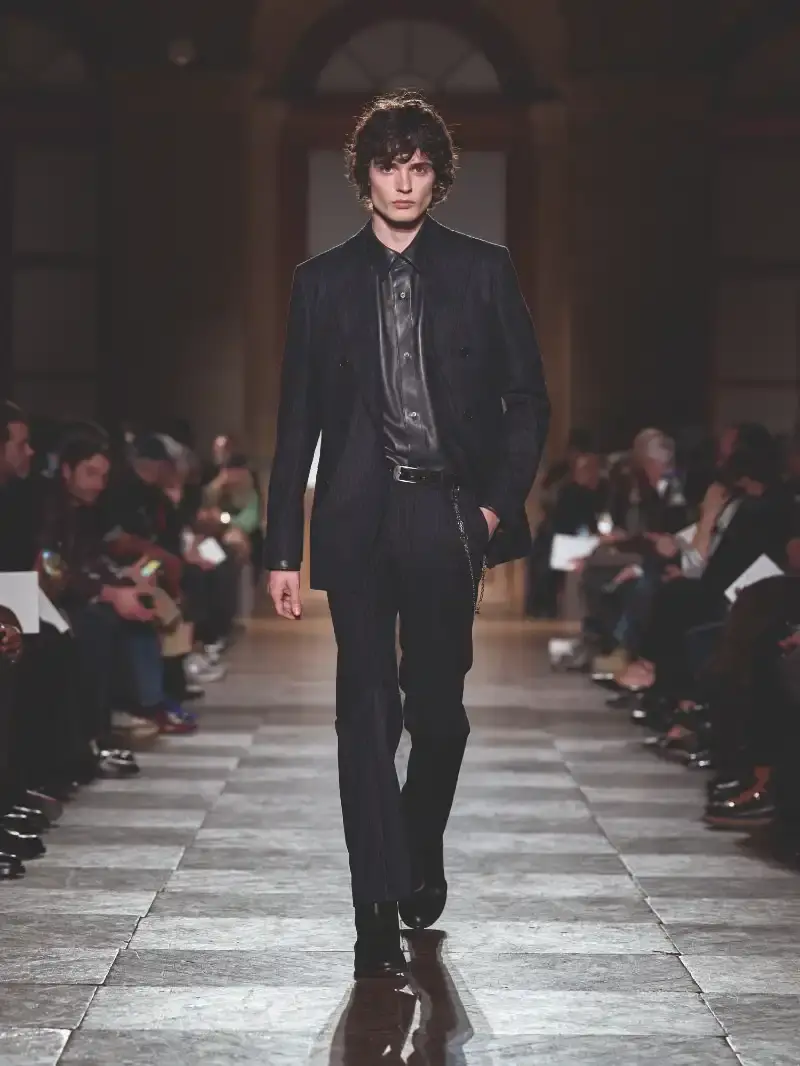 HERMÈS MENSWEAR FW26 COLLECTION Article about Hermès Fall Winter 2026 menswear collection designed by Véronique Nichanian. The collection emphasizes clean construction, quality fabrics, and interior garment finishing. Color palette ranges from hemp and lichen to saffron and midnight blue. The design philosophy focuses on timeless pieces and precise craftsmanship. (image 46 of 58)
