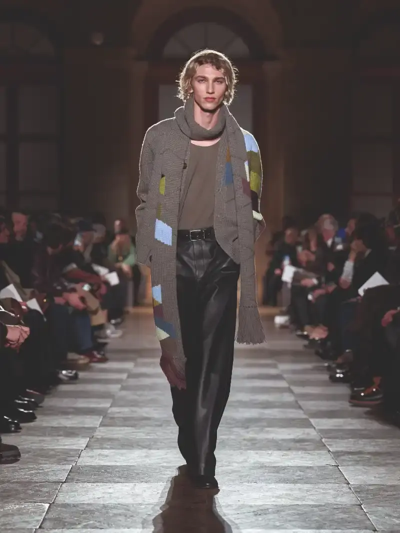 HERMÈS MENSWEAR FW26 COLLECTION Article about Hermès Fall Winter 2026 menswear collection designed by Véronique Nichanian. The collection emphasizes clean construction, quality fabrics, and interior garment finishing. Color palette ranges from hemp and lichen to saffron and midnight blue. The design philosophy focuses on timeless pieces and precise craftsmanship. (image 27 of 58)