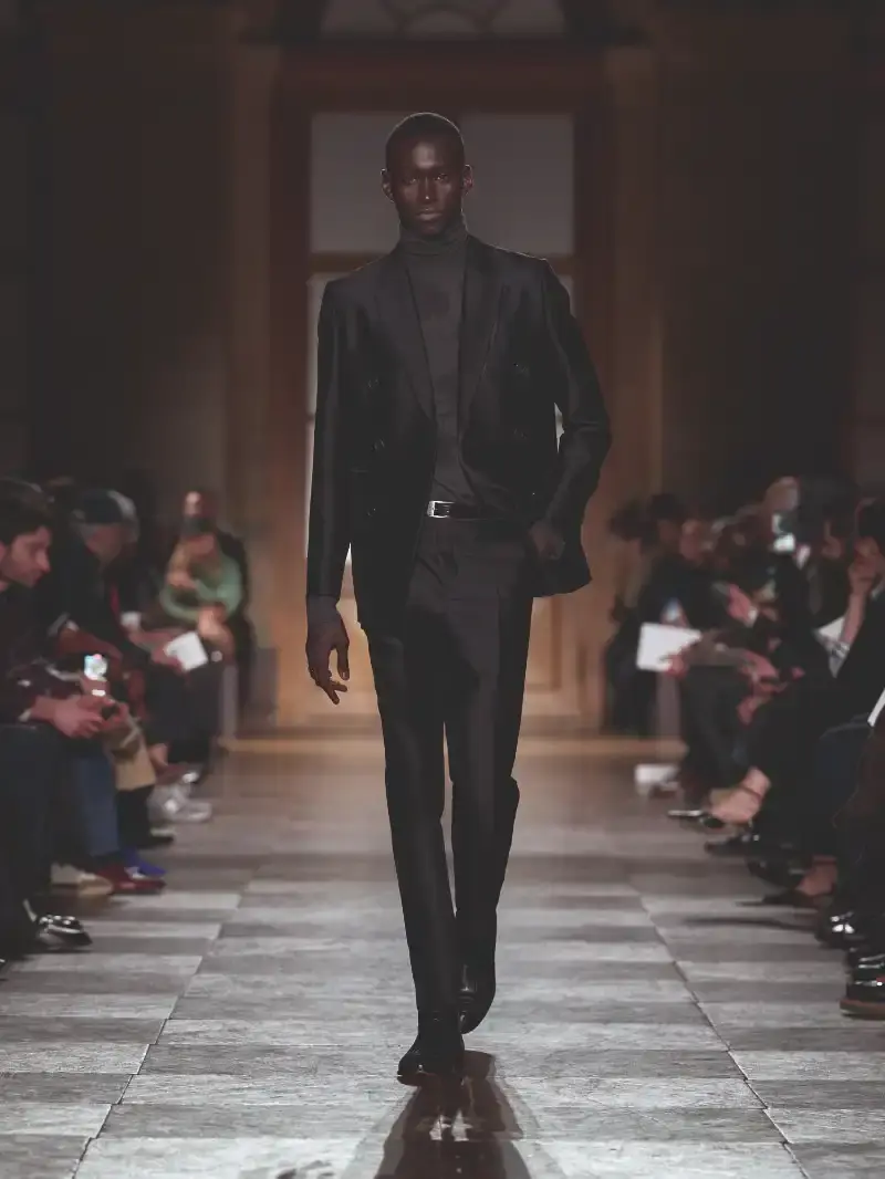 HERMÈS MENSWEAR FW26 COLLECTION Article about Hermès Fall Winter 2026 menswear collection designed by Véronique Nichanian. The collection emphasizes clean construction, quality fabrics, and interior garment finishing. Color palette ranges from hemp and lichen to saffron and midnight blue. The design philosophy focuses on timeless pieces and precise craftsmanship. (image 58 of 58)