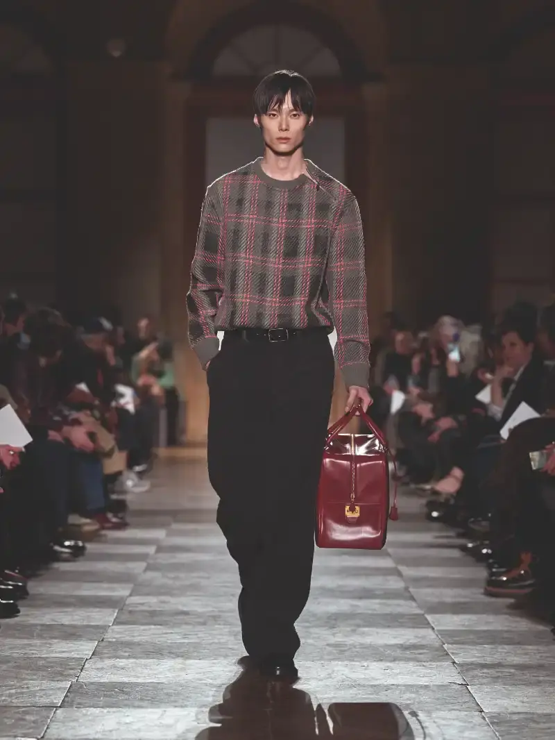 HERMÈS MENSWEAR FW26 COLLECTION Article about Hermès Fall Winter 2026 menswear collection designed by Véronique Nichanian. The collection emphasizes clean construction, quality fabrics, and interior garment finishing. Color palette ranges from hemp and lichen to saffron and midnight blue. The design philosophy focuses on timeless pieces and precise craftsmanship. (image 11 of 58)