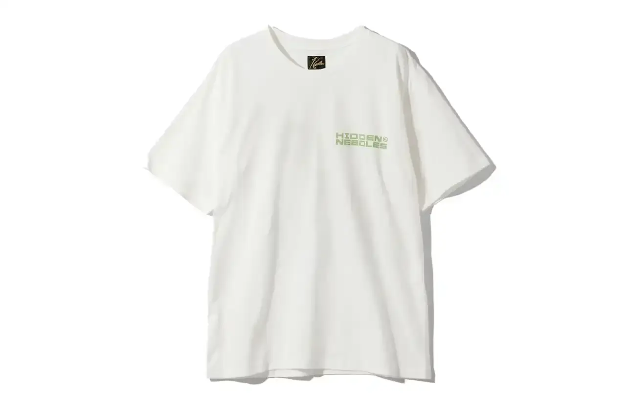 HIDDEN.NY AND NEEDLES UNVEIL LATEST COLLAB CAPSULE HIDDEN.NY and NEEDLES streetwear collaboration capsule collection featuring green hues, overlapping logos, and digital-inspired graphics on classic NEEDLES styles like Cut t-shirts, tracksuits, and mohair cardigans. Exclusive launch at NEPENTHES Tokyo on September 27, including unique REBUILD BY NEEDLES pieces (image 7 of 15)