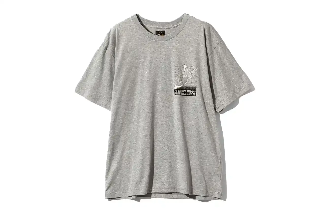 HIDDEN.NY AND NEEDLES UNVEIL LATEST COLLAB CAPSULE HIDDEN.NY and NEEDLES streetwear collaboration capsule collection featuring green hues, overlapping logos, and digital-inspired graphics on classic NEEDLES styles like Cut t-shirts, tracksuits, and mohair cardigans. Exclusive launch at NEPENTHES Tokyo on September 27, including unique REBUILD BY NEEDLES pieces (image 3 of 15)