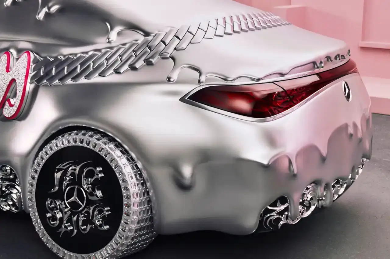 CLA GETS ROYAL CHROME TREATMENT IN ICE SPICE'S MERCEDES COLLAB image of rapper Ice Spice's custom collaboration with Mercedes-Benz, featuring a chrome-finished CLA model with princess-themed detailing. It explains that this is part of Mercedes' "Class of Creators" initiative, where five artists will create custom interpretations of the CLA. The piece details the unveiling event at Mercedes' New York dealership, which included performances from Broadway's "Hell's Kitchen" cast and music by DJ LPX. The article also mentions Ice Spice's upcoming merchandise collection and notes that other collaborators will include Gustaf Westman, KidSuper, League of Legends, and Hot Wheels. (image 7 of 11)
