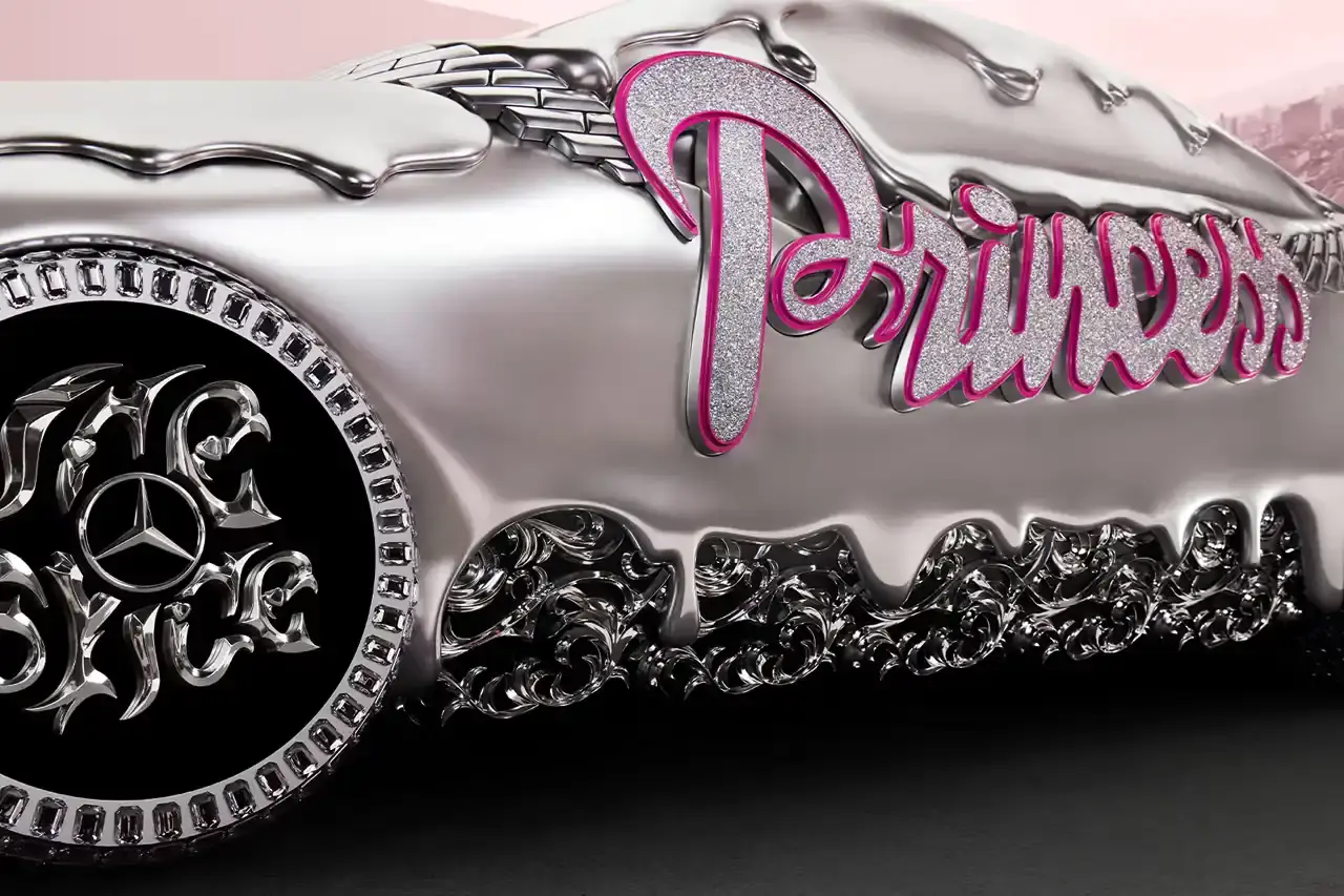 CLA GETS ROYAL CHROME TREATMENT IN ICE SPICE'S MERCEDES COLLAB image of rapper Ice Spice's custom collaboration with Mercedes-Benz, featuring a chrome-finished CLA model with princess-themed detailing. It explains that this is part of Mercedes' "Class of Creators" initiative, where five artists will create custom interpretations of the CLA. The piece details the unveiling event at Mercedes' New York dealership, which included performances from Broadway's "Hell's Kitchen" cast and music by DJ LPX. The article also mentions Ice Spice's upcoming merchandise collection and notes that other collaborators will include Gustaf Westman, KidSuper, League of Legends, and Hot Wheels. (image 11 of 11)