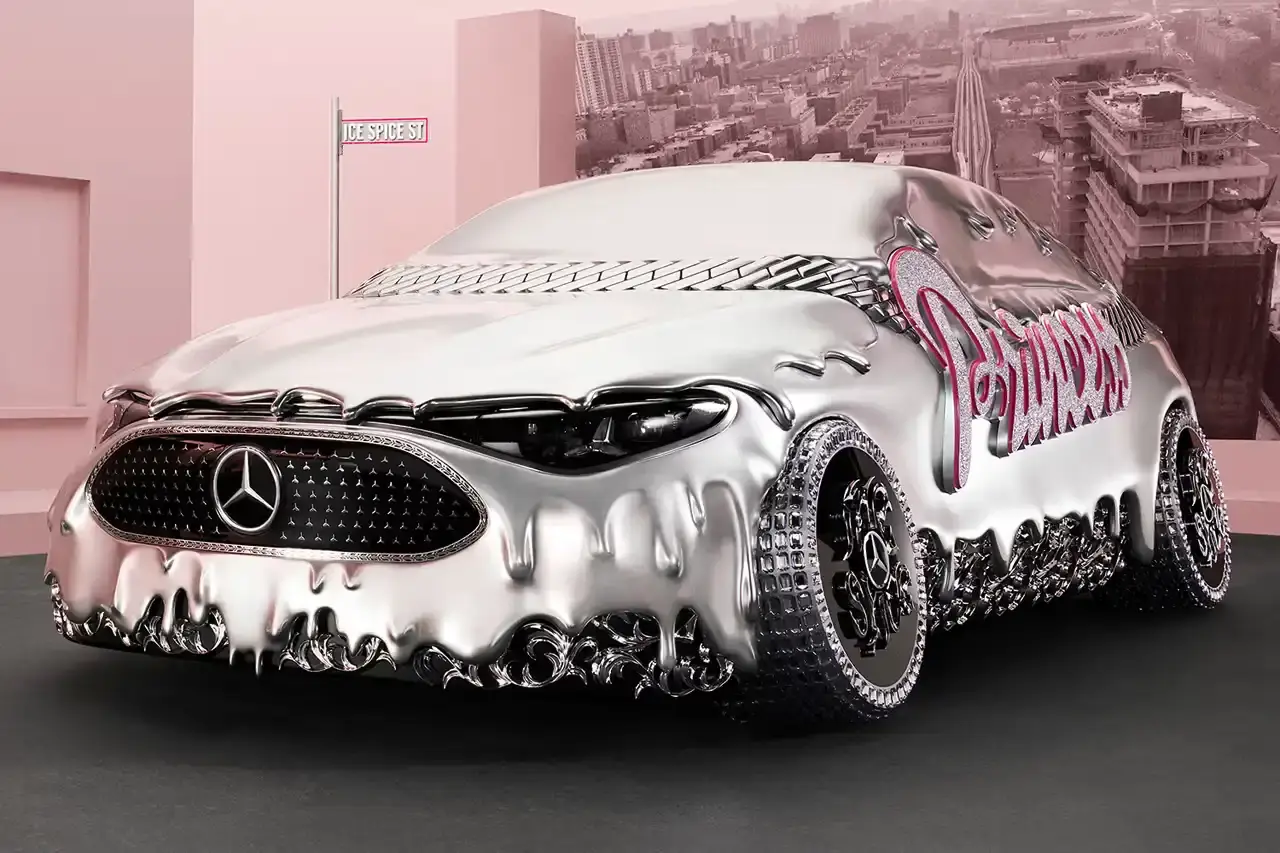 CLA GETS ROYAL CHROME TREATMENT IN ICE SPICE'S MERCEDES COLLAB image of rapper Ice Spice's custom collaboration with Mercedes-Benz, featuring a chrome-finished CLA model with princess-themed detailing. It explains that this is part of Mercedes' "Class of Creators" initiative, where five artists will create custom interpretations of the CLA. The piece details the unveiling event at Mercedes' New York dealership, which included performances from Broadway's "Hell's Kitchen" cast and music by DJ LPX. The article also mentions Ice Spice's upcoming merchandise collection and notes that other collaborators will include Gustaf Westman, KidSuper, League of Legends, and Hot Wheels. (image 5 of 11)