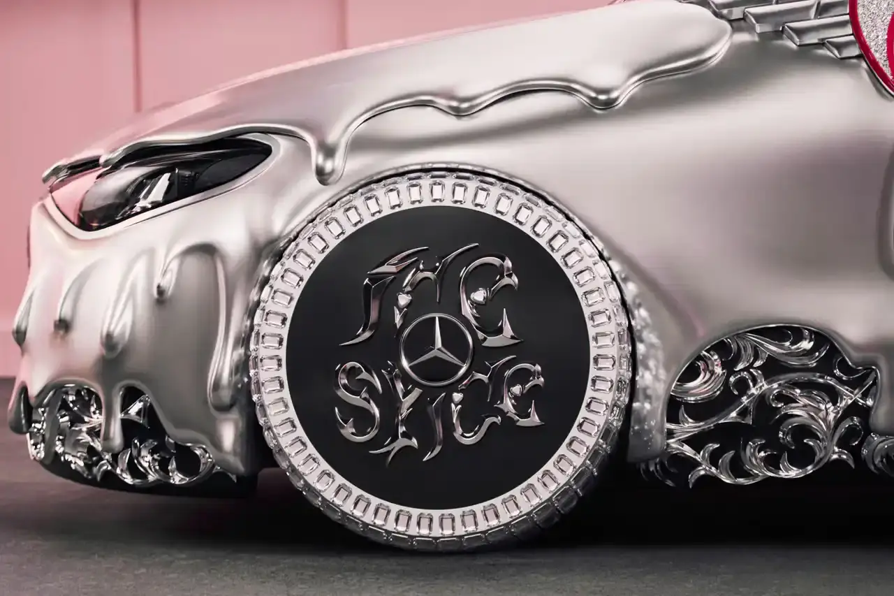 CLA GETS ROYAL CHROME TREATMENT IN ICE SPICE'S MERCEDES COLLAB image of rapper Ice Spice's custom collaboration with Mercedes-Benz, featuring a chrome-finished CLA model with princess-themed detailing. It explains that this is part of Mercedes' "Class of Creators" initiative, where five artists will create custom interpretations of the CLA. The piece details the unveiling event at Mercedes' New York dealership, which included performances from Broadway's "Hell's Kitchen" cast and music by DJ LPX. The article also mentions Ice Spice's upcoming merchandise collection and notes that other collaborators will include Gustaf Westman, KidSuper, League of Legends, and Hot Wheels. (image 10 of 11)