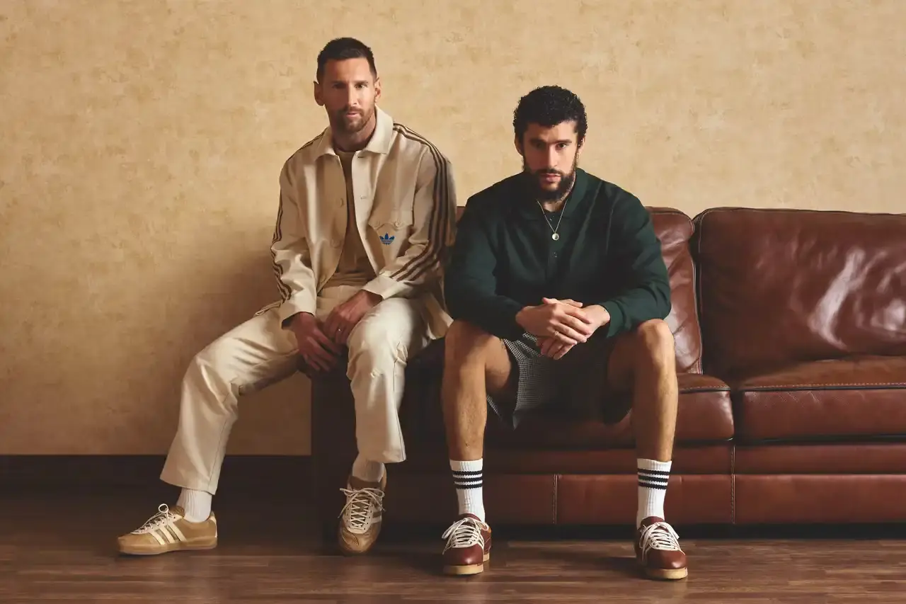 INSIDE THE LINES: ADIDAS PAIRS BAD BUNNY AND MESSI FOR LIMITED EDITION RELEASE adidas Gazelle sneaker in cream leather with brown accents, co-designed by Bad Bunny and Lionel Messi, shown from side angle displaying X-shaped heel stripes and signature details
