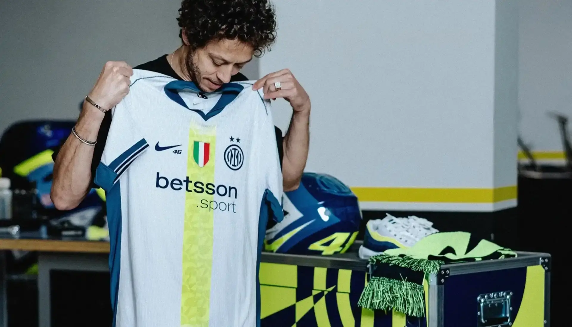 VALENTINO ROSSI INSPIRES INTER'S SPECIAL NIKE AWAY SHIRT photo of special edition Inter Milan away kit created in collaboration with MotoGP champion Valentino Rossi and Nike. The jersey incorporates Rossi's famous Sun and Moon symbols and his racing number 46. The kit will debut during Inter's match against Cagliari on April 12, 2025. The article includes quotes from Rossi expressing his excitement about the collaboration between his two passions: motorcycle racing and football. Information on how to purchase the limited edition shirt is provided at the end. (image 4 of 9)
