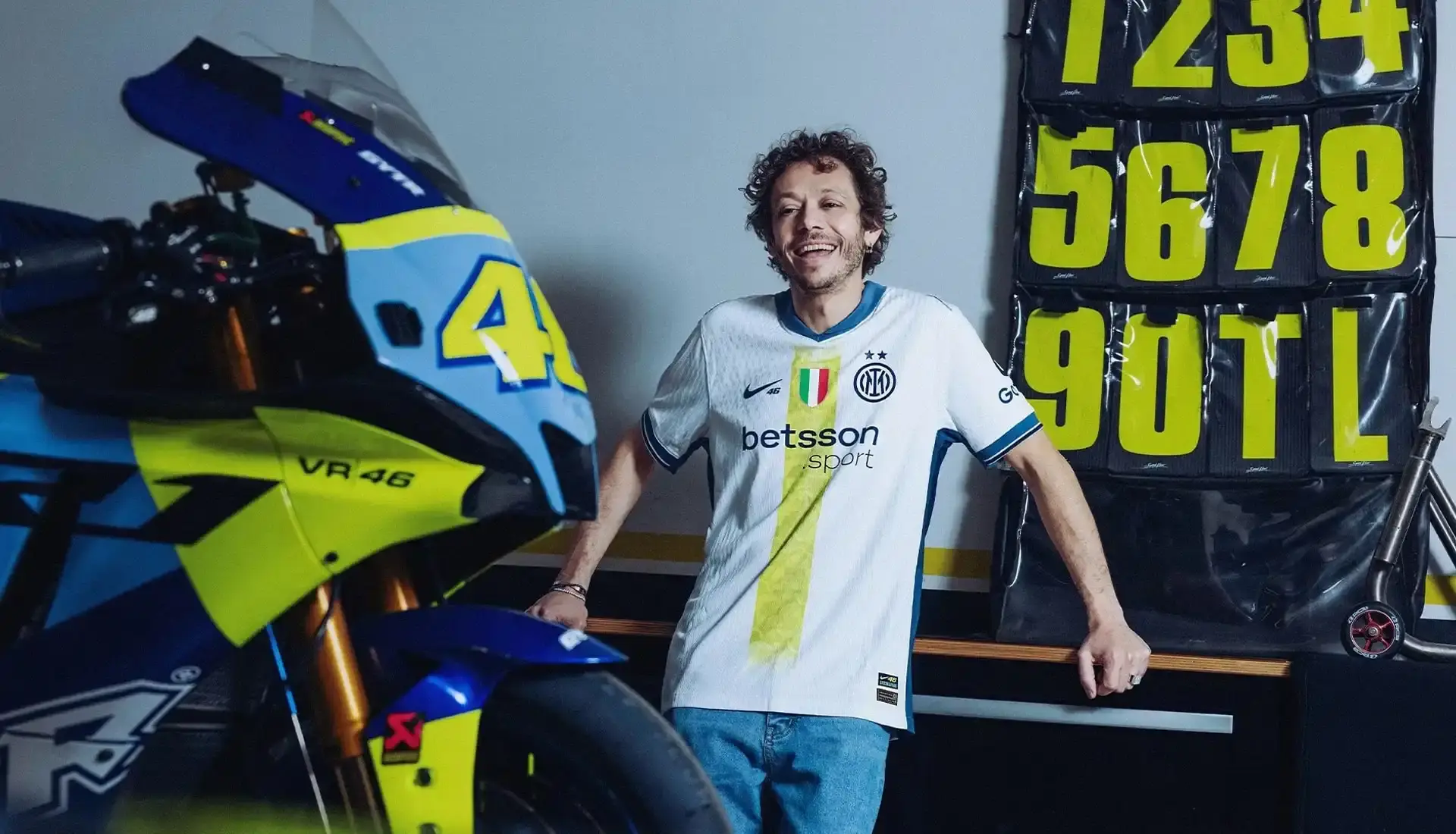 VALENTINO ROSSI INSPIRES INTER'S SPECIAL NIKE AWAY SHIRT photo of special edition Inter Milan away kit created in collaboration with MotoGP champion Valentino Rossi and Nike. The jersey incorporates Rossi's famous Sun and Moon symbols and his racing number 46. The kit will debut during Inter's match against Cagliari on April 12, 2025. The article includes quotes from Rossi expressing his excitement about the collaboration between his two passions: motorcycle racing and football. Information on how to purchase the limited edition shirt is provided at the end.