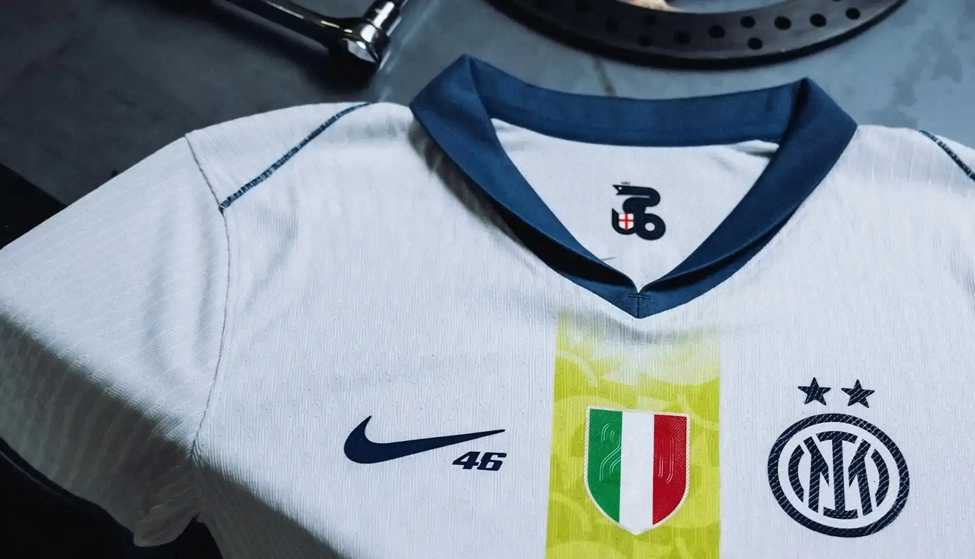 VALENTINO ROSSI INSPIRES INTER'S SPECIAL NIKE AWAY SHIRT photo of special edition Inter Milan away kit created in collaboration with MotoGP champion Valentino Rossi and Nike. The jersey incorporates Rossi's famous Sun and Moon symbols and his racing number 46. The kit will debut during Inter's match against Cagliari on April 12, 2025. The article includes quotes from Rossi expressing his excitement about the collaboration between his two passions: motorcycle racing and football. Information on how to purchase the limited edition shirt is provided at the end. (image 7 of 9)