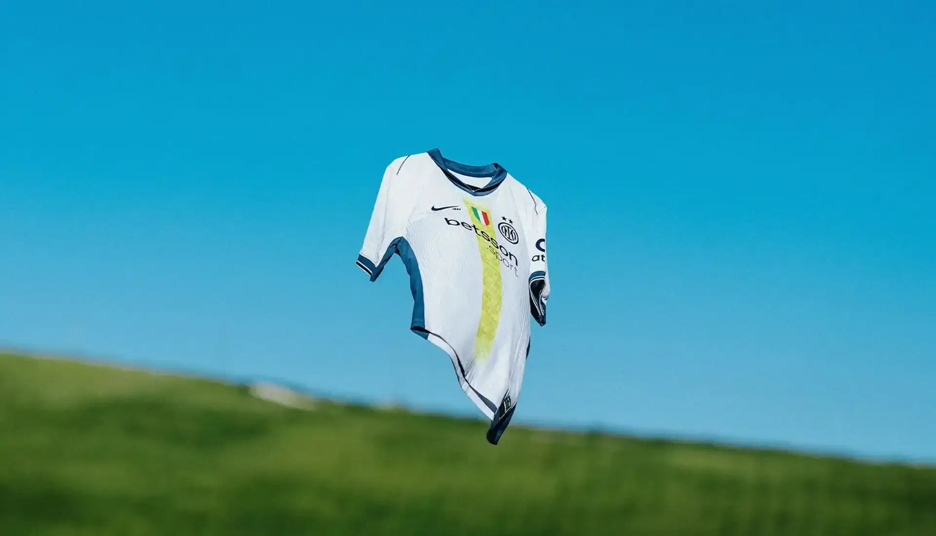 VALENTINO ROSSI INSPIRES INTER'S SPECIAL NIKE AWAY SHIRT photo of special edition Inter Milan away kit created in collaboration with MotoGP champion Valentino Rossi and Nike. The jersey incorporates Rossi's famous Sun and Moon symbols and his racing number 46. The kit will debut during Inter's match against Cagliari on April 12, 2025. The article includes quotes from Rossi expressing his excitement about the collaboration between his two passions: motorcycle racing and football. Information on how to purchase the limited edition shirt is provided at the end. (image 9 of 9)