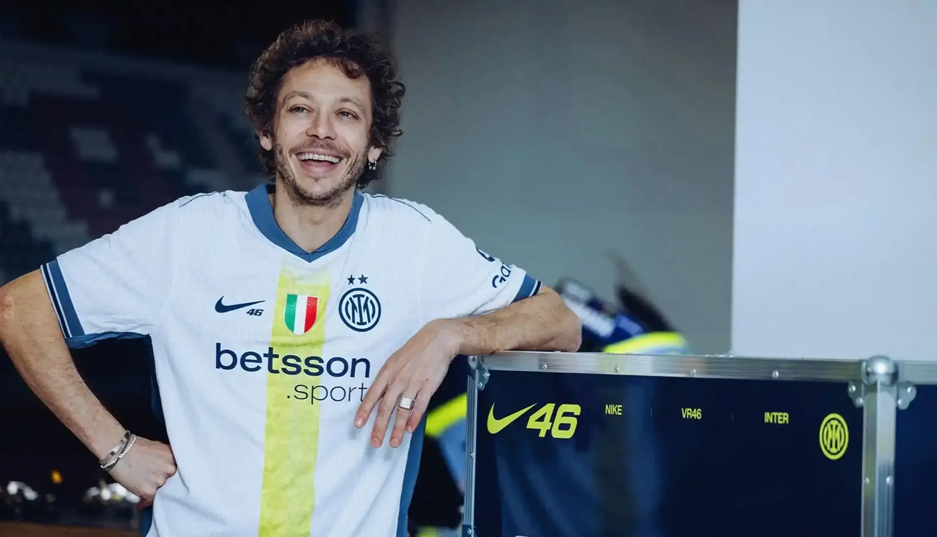 VALENTINO ROSSI INSPIRES INTER'S SPECIAL NIKE AWAY SHIRT photo of special edition Inter Milan away kit created in collaboration with MotoGP champion Valentino Rossi and Nike. The jersey incorporates Rossi's famous Sun and Moon symbols and his racing number 46. The kit will debut during Inter's match against Cagliari on April 12, 2025. The article includes quotes from Rossi expressing his excitement about the collaboration between his two passions: motorcycle racing and football. Information on how to purchase the limited edition shirt is provided at the end. (image 5 of 9)