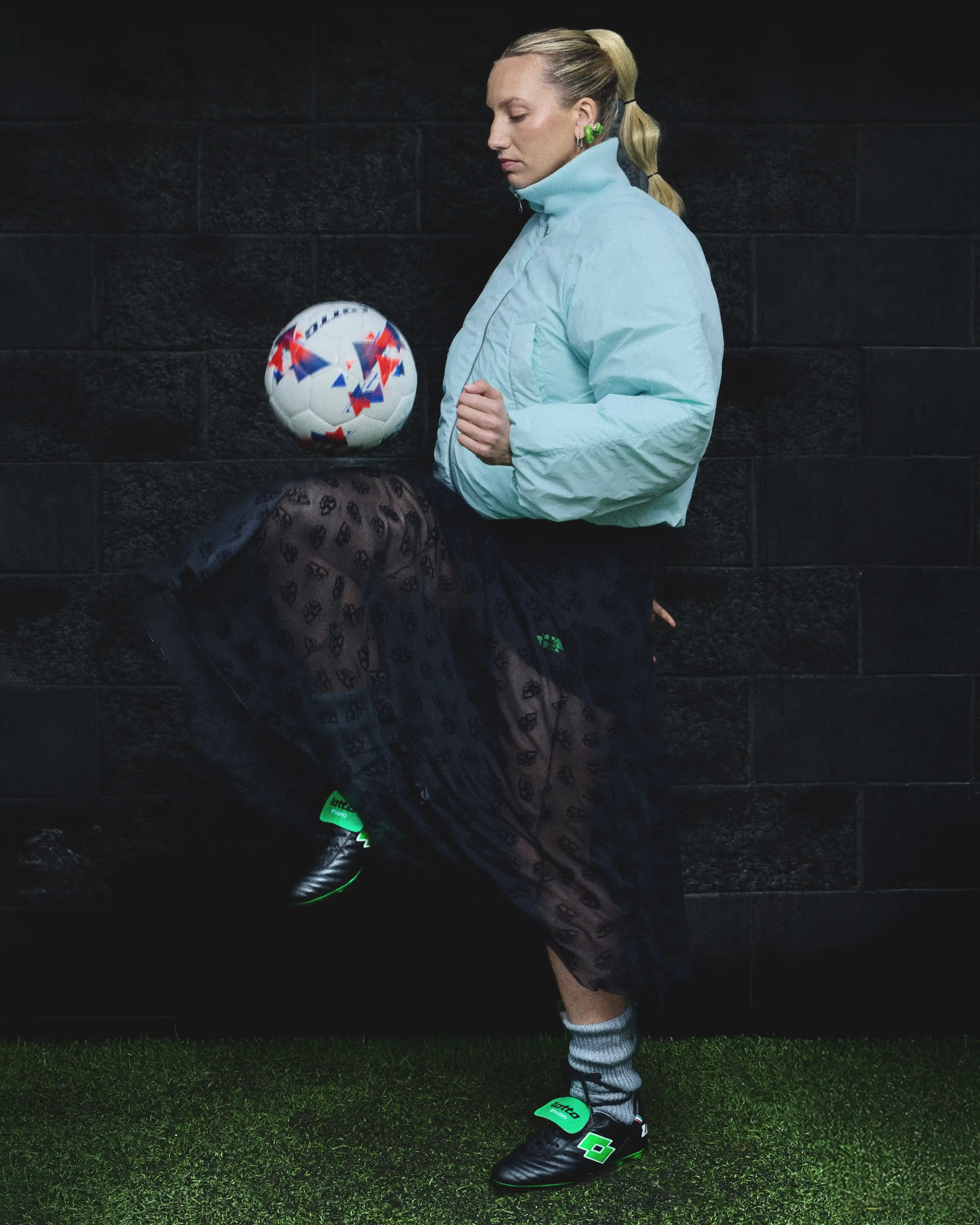 JACKET: MINIMUM / SKIRT: MACCAPANI / SHORTS, SHOES & FOOTBALL: LOTTO SPORT ITALIA / SOCKS: STYLIST’S OWN / EARRINGS: ARIANNA FABIANO JEWELRY JACKET: MINIMUM / SKIRT: MACCAPANI / SHORTS, SHOES & FOOTBALL: LOTTO SPORT ITALIA / SOCKS: STYLIST’S OWN / EARRINGS: ARIANNA FABIANO JEWELRY
