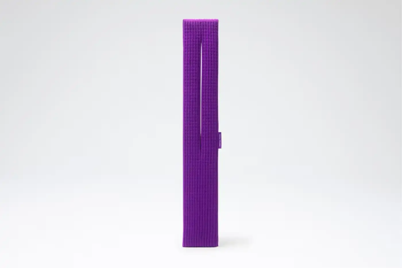 ISSEY MIYAKE AND APPLE LAUNCH IPHONE POCKET A 3D-knitted textile iPhone holder in a rectangular shape with ribbed pleated structure, available with short wrist strap or long crossbody strap in multiple colors, designed by Issey Miyake and Apple. (image 7 of 12)