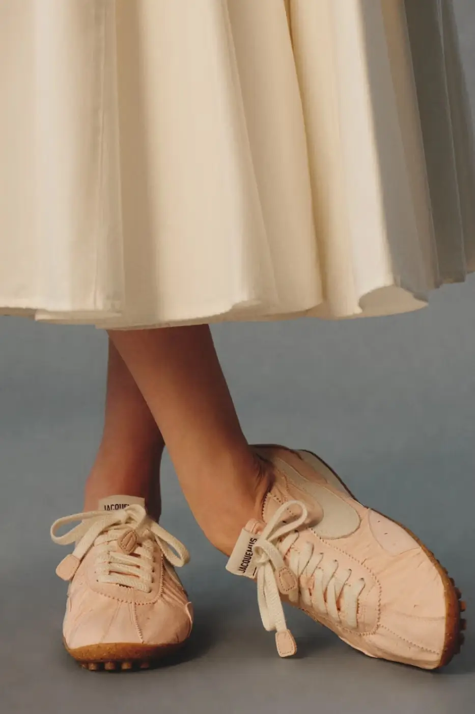 JACQUEMUS AND NIKE DROP NEW MOON SHOES FOR 2026 A text article detailing the Spring 2026 release of three new Jacquemus and Nike Moon Shoe colorways including pricing and design specifications. (image 5 of 8)