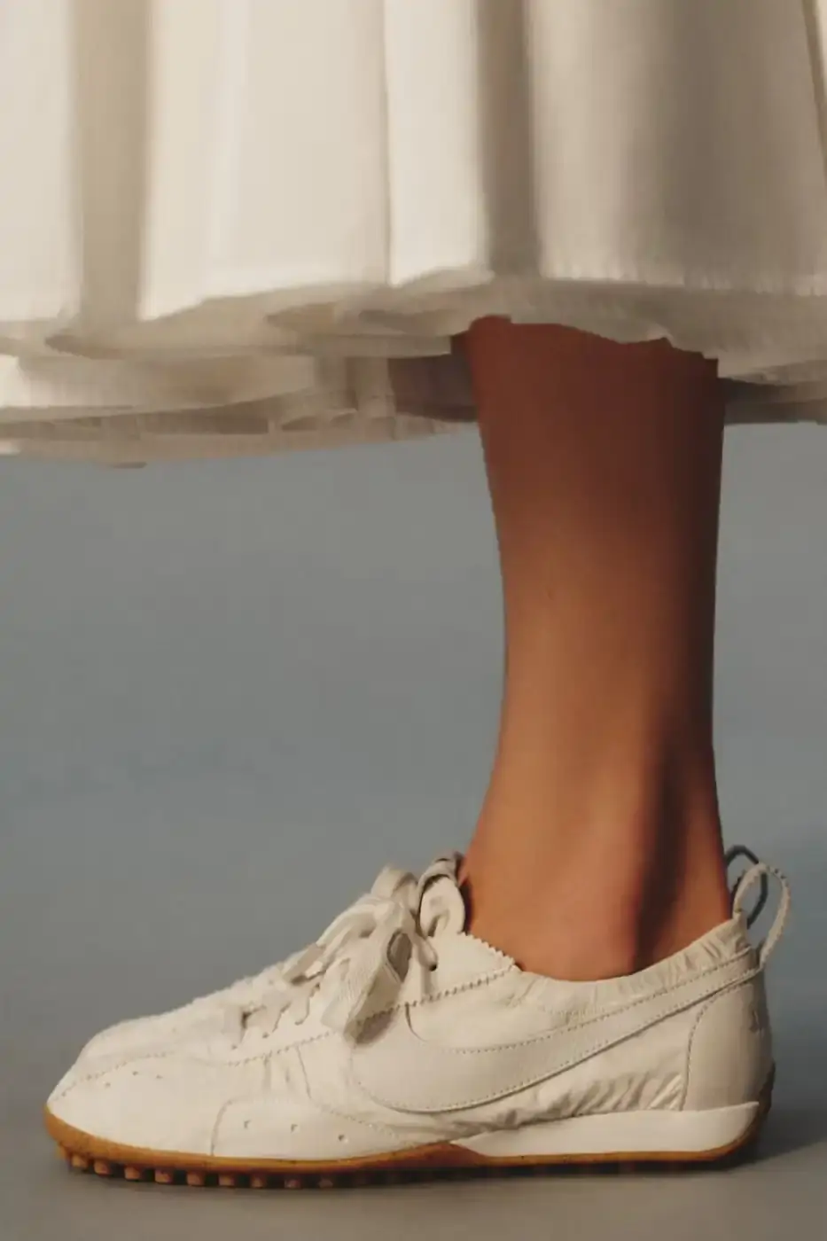 JACQUEMUS AND NIKE DROP NEW MOON SHOES FOR 2026 A text article detailing the Spring 2026 release of three new Jacquemus and Nike Moon Shoe colorways including pricing and design specifications. (image 7 of 8)
