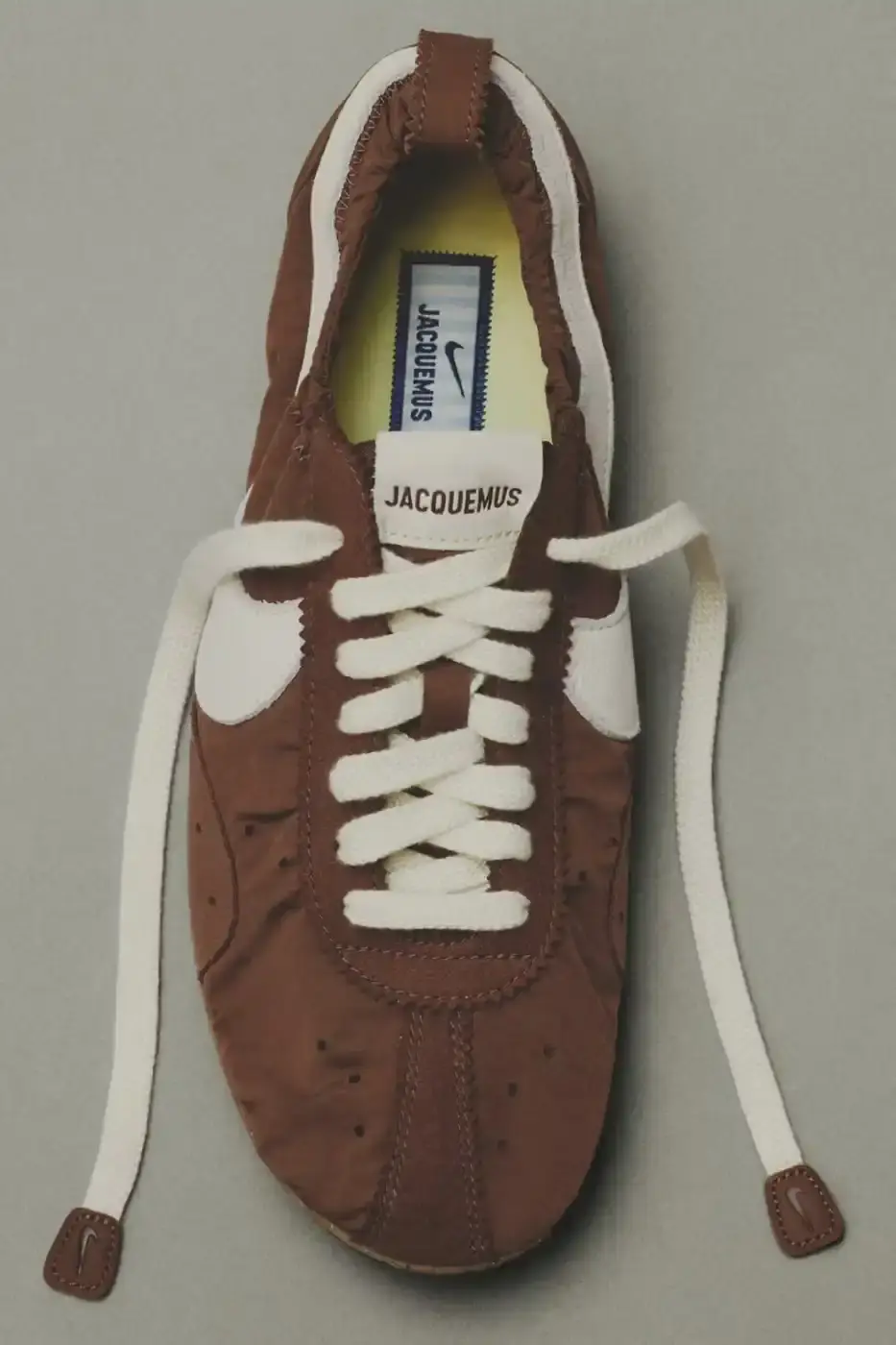 JACQUEMUS AND NIKE DROP NEW MOON SHOES FOR 2026 A text article detailing the Spring 2026 release of three new Jacquemus and Nike Moon Shoe colorways including pricing and design specifications.