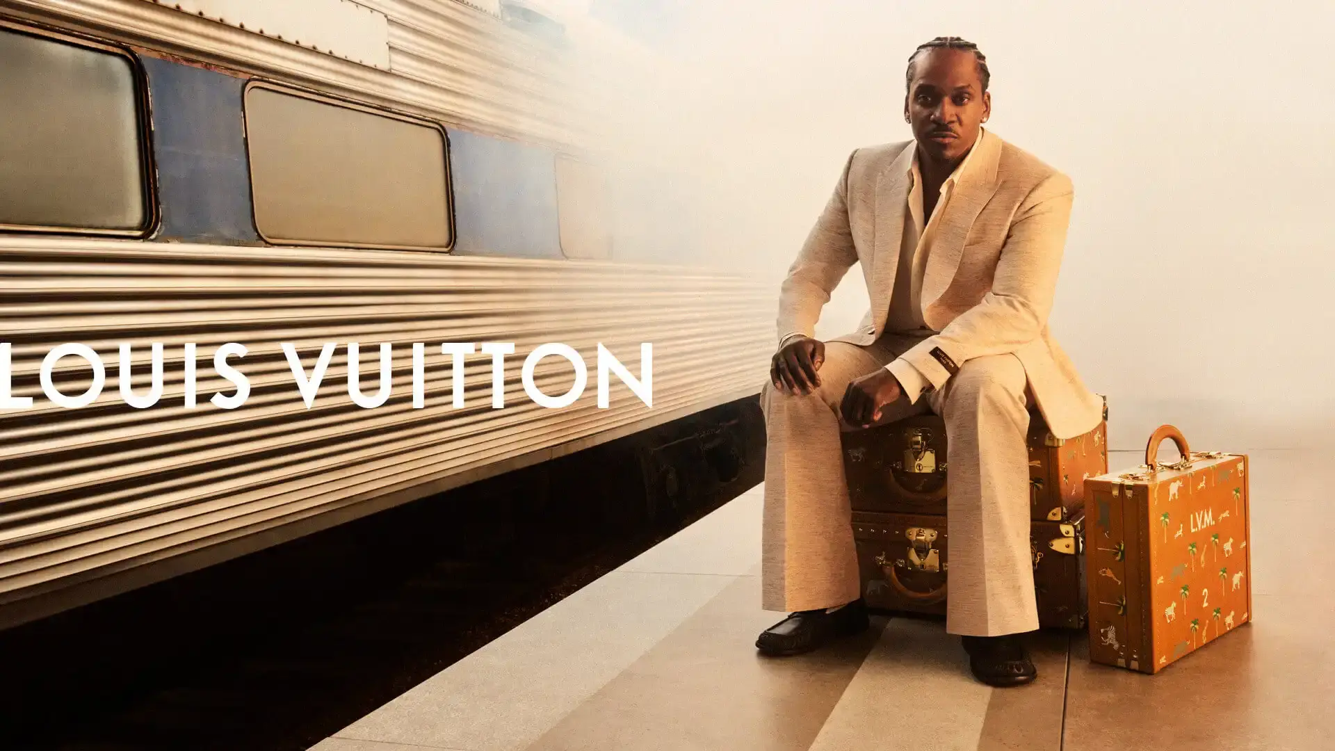 Louis Vuitton's new campaign features brand ambassadors Jeremy Allen White and Pusha T in travel-themed photography by Drew Vickers, showcasing the spring/summer 2026 menswear collection designed by Pharrell Williams.