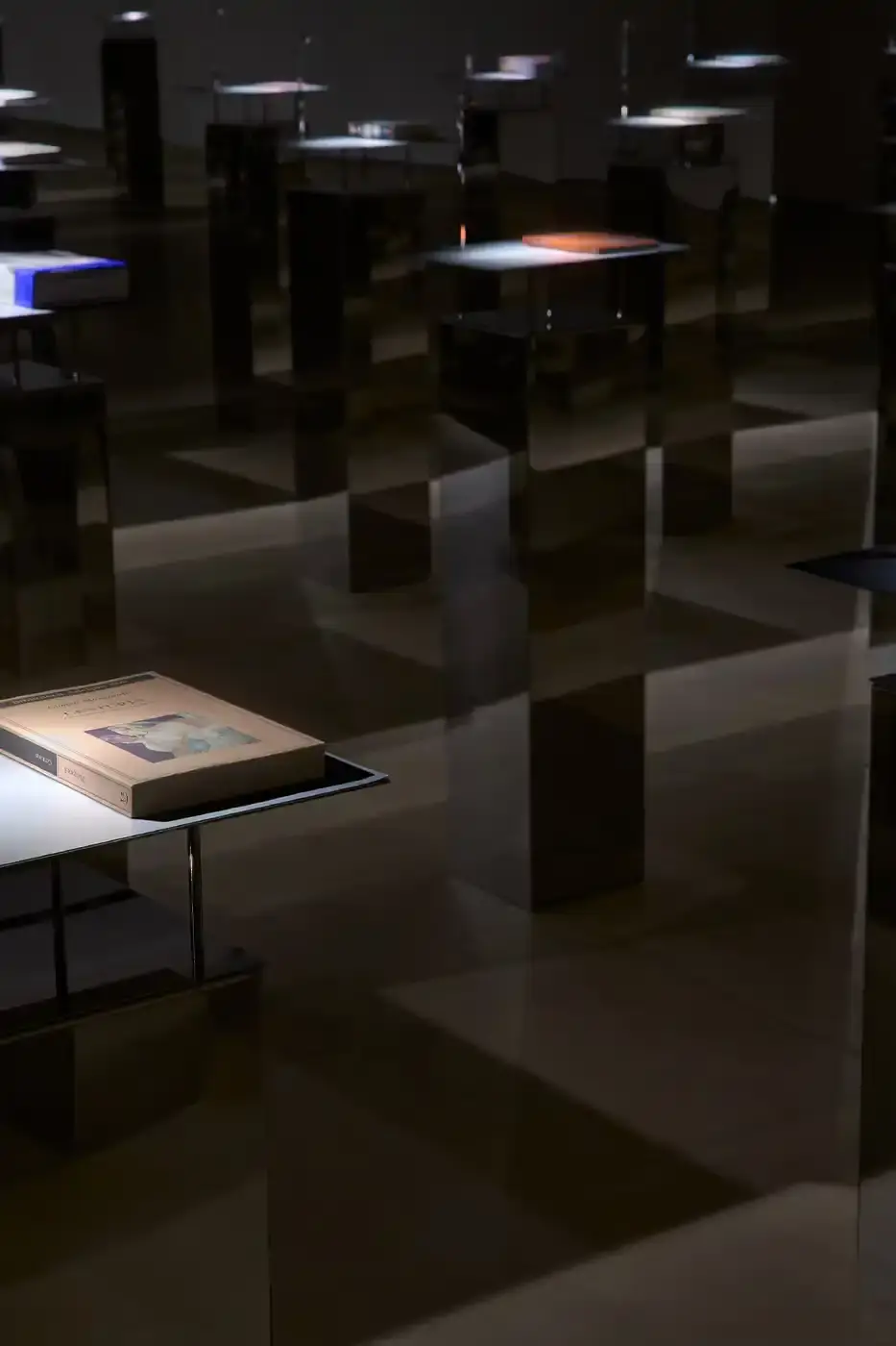 JIL SANDER AND APARTAMENTO OPEN MILAN REFERENCE LIBRARY image detailing the Reference Library by Jil Sander exhibition in Milan. The article lists location details, dates, and the physical setup of the book installation. (image 4 of 7)