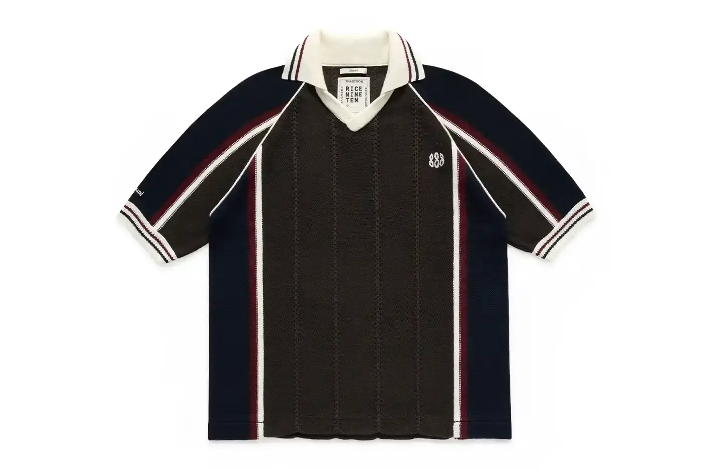MONTRÉAL'S JJJJOUND TEAMS UP WITH RICE NINE TEN ON KNIT SOCCER JERSEY image of the collaboration between JJJJound and RICE NINE TEN featuring a limited-edition knitted soccer jersey. The piece details the jersey's design elements including textured tuck pattern, contrasting trim, hand-embroidered emblems, and color scheme. Information includes the release date of May 22 at 12 p.m. EST exclusively through JJJJound's website. This is noted as the first partnership between the Montréal design studio and the Japanese brand led by designer Shohei Kimura.