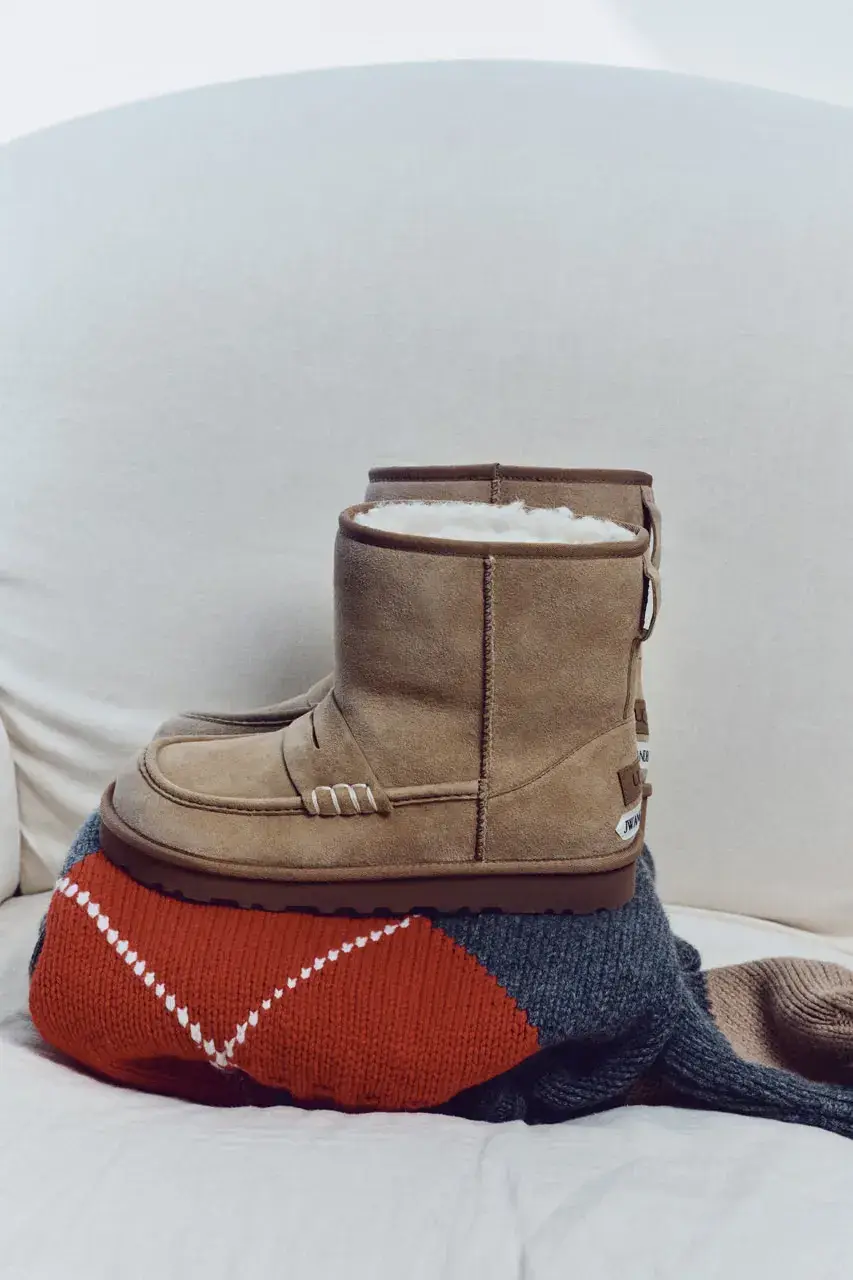 JW ANDERSON AND UGG RELEASE FOOTWEAR COLLABORATION image detailing the JW Anderson and UGG footwear collaboration launch on October 15 featuring musician Blood Orange. (image 5 of 8)