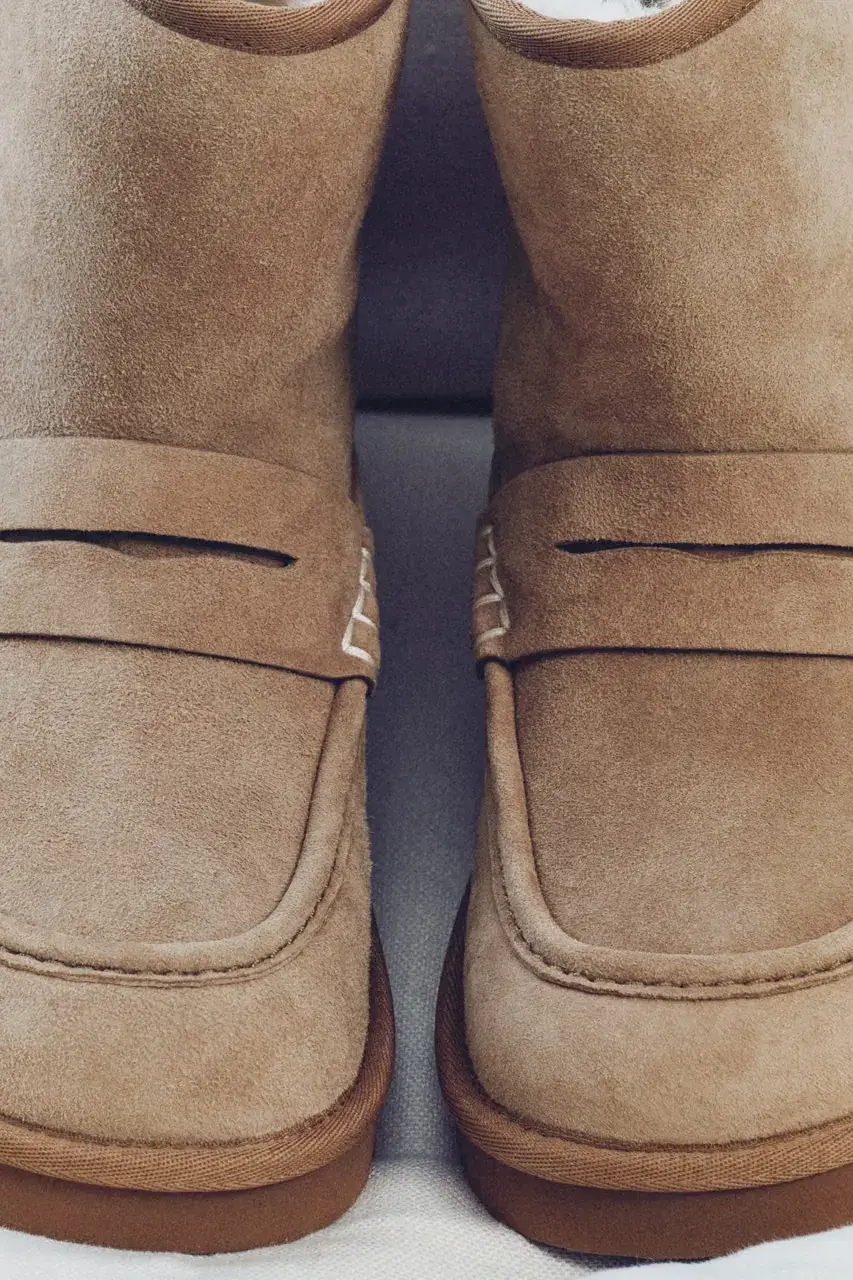 JW ANDERSON AND UGG RELEASE FOOTWEAR COLLABORATION image detailing the JW Anderson and UGG footwear collaboration launch on October 15 featuring musician Blood Orange. (image 6 of 8)
