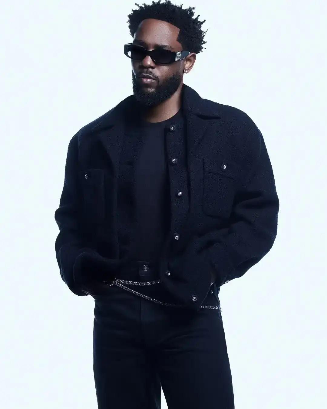 image of Kendrick Lamar becoming Chanel's newest brand ambassador, focusing specifically on their eyewear line. The piece covers the announcement of their partnership, Lamar's previous connections with Chanel including his 2023 Met Gala appearance, and the collaboration between Chanel and Lamar's creative company pgLang. It includes quotes from both Lamar and Chanel's fashion division president Bruno Pavlovsky about the partnership. The article notes that while Chanel rarely produces menswear, Lamar joins other male ambassadors like G-Dragon and Timothée Chalamet who have represented the luxury brand.