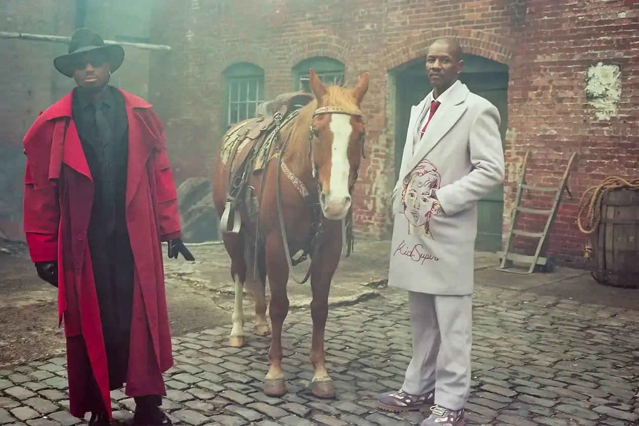 KIDSUPER DEBUTS RECORD LABEL WITH QUAVO AND GIGGS COLLABORATION Colm Dillane, Quavo, and Giggs wearing KidSuper STRING THEORY collection pieces during music video shoot (image 5 of 6)