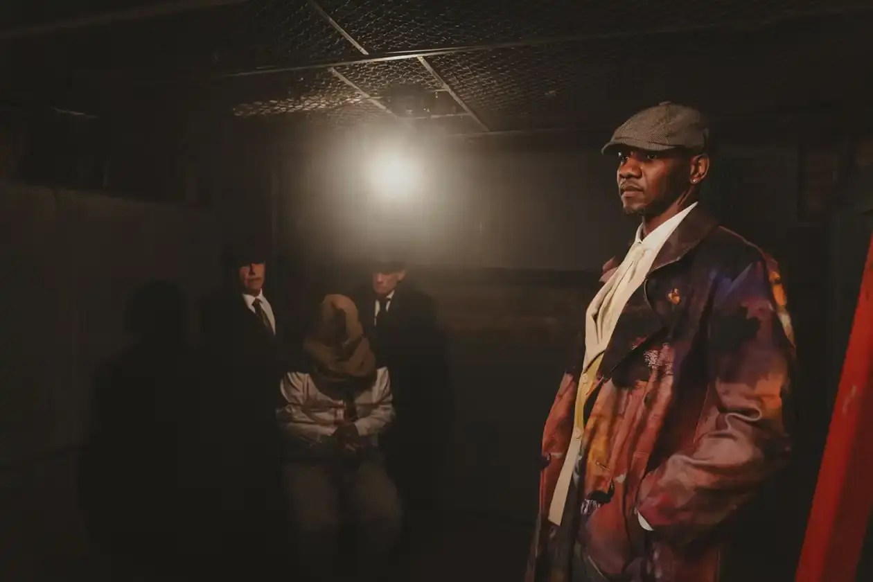 KIDSUPER DEBUTS RECORD LABEL WITH QUAVO AND GIGGS COLLABORATION Colm Dillane, Quavo, and Giggs wearing KidSuper STRING THEORY collection pieces during music video shoot (image 2 of 6)
