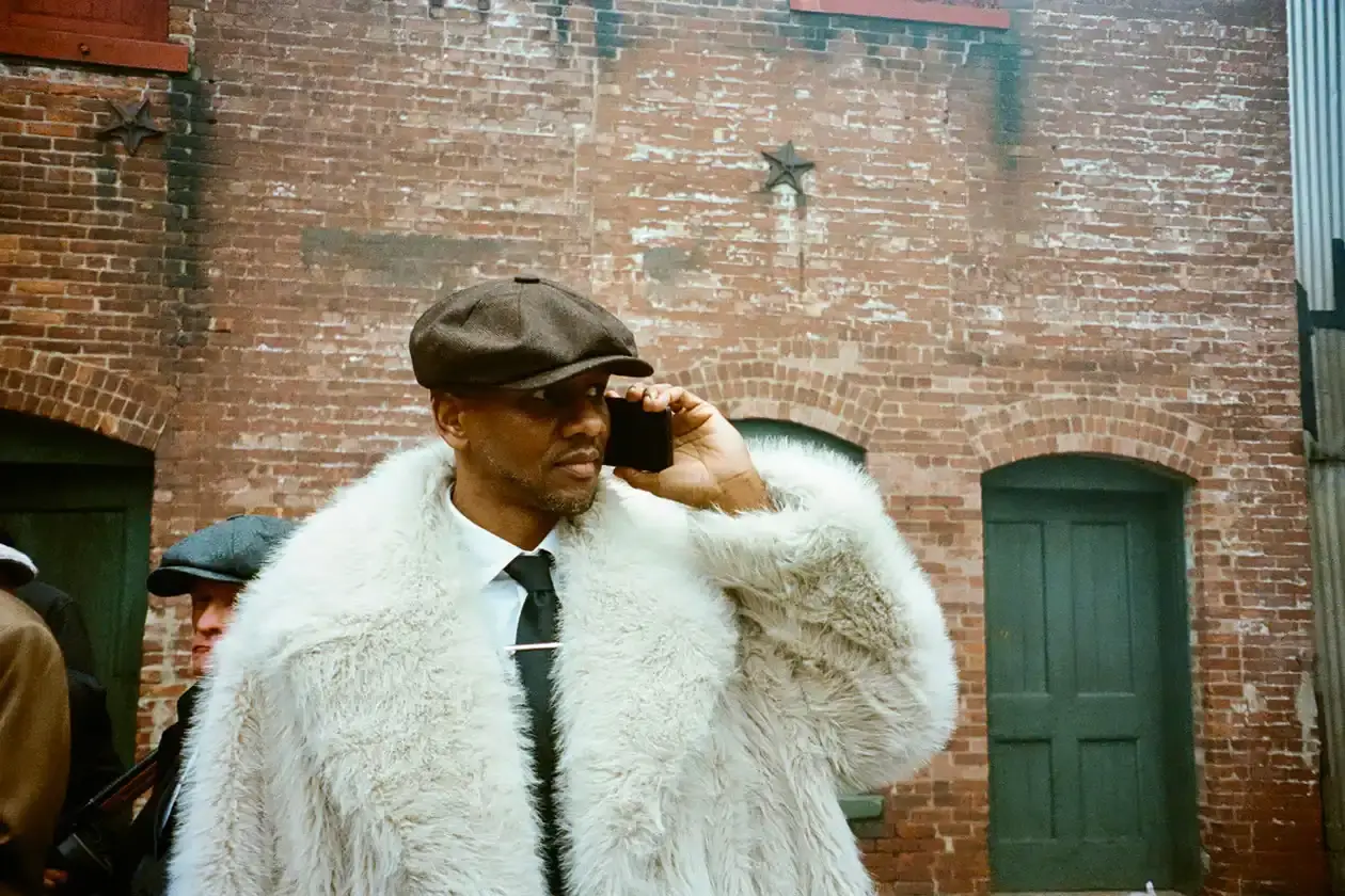 KIDSUPER DEBUTS RECORD LABEL WITH QUAVO AND GIGGS COLLABORATION Colm Dillane, Quavo, and Giggs wearing KidSuper STRING THEORY collection pieces during music video shoot (image 3 of 6)