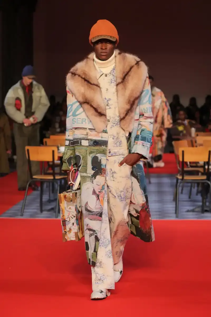 KIDSUPER SHIFTS TONE FOR FALL/WINTER 2026 KidSuper Fall/Winter 2026 collection article discussing the brand's new direction with stylist Imruh Asha, featuring a short film with Vincent Cassel and collaborations with Jameson and Havaianas at paris fashion week (image 6 of 28)