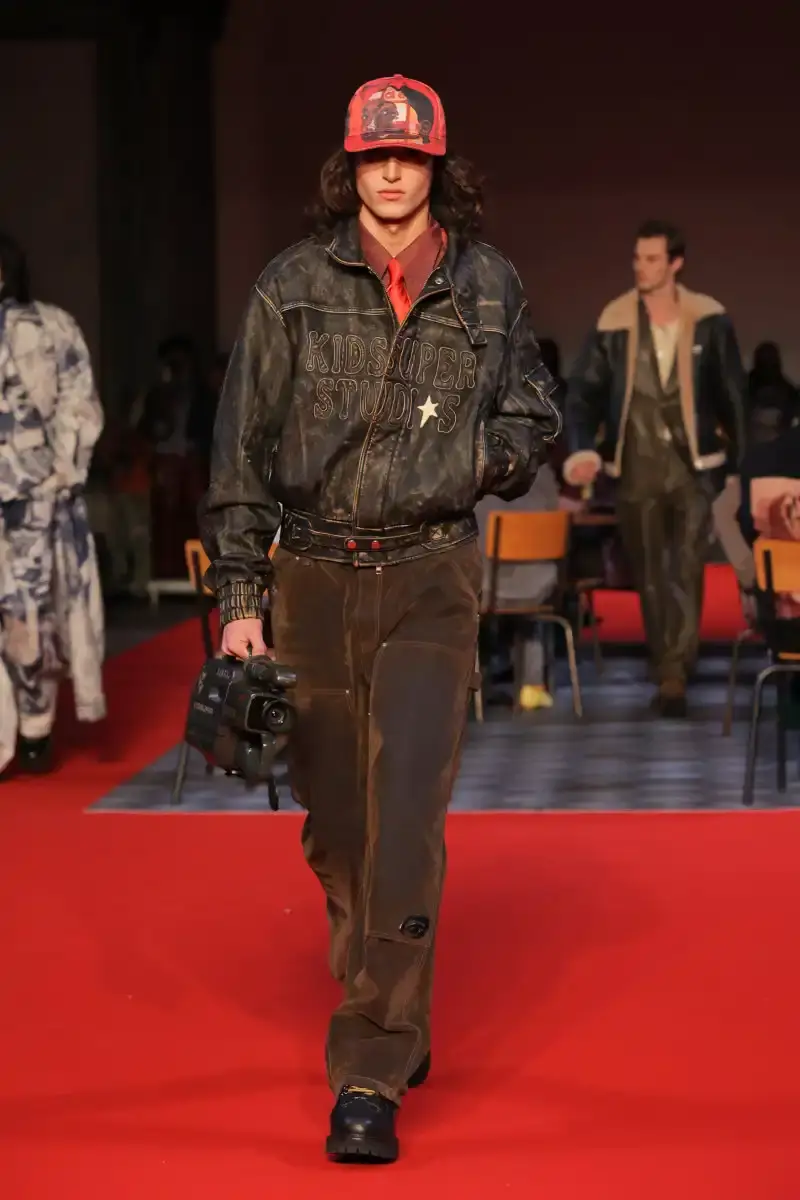 KIDSUPER SHIFTS TONE FOR FALL/WINTER 2026 KidSuper Fall/Winter 2026 collection article discussing the brand's new direction with stylist Imruh Asha, featuring a short film with Vincent Cassel and collaborations with Jameson and Havaianas at paris fashion week (image 28 of 28)
