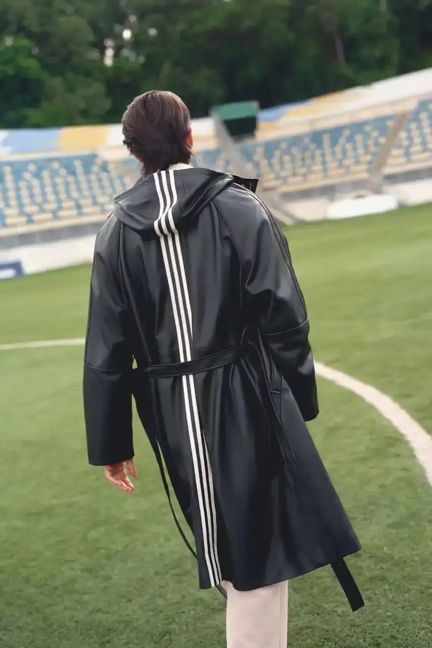 KITH AND ADIDAS FOOTBALL REUNITE AFTER SEVEN-YEAR HIATUS This article announces the Spring 2025 collaboration between Kith and adidas Football after a seven-year hiatus. The collection includes premium apparel (stadium coats, tracksuits, jerseys), footwear (custom Predator models and lifestyle options), and accessories (scarves, bags, headwear). Special collaborations with ESPN, Chase, and DHL Express are highlighted. The full collection launches April 18 online and in Kith retail locations. The article is structured in six paragraphs that outline the collaboration's scope, key apparel pieces, special partnerships, footwear offerings, accessories, and release details. (image 8 of 20)